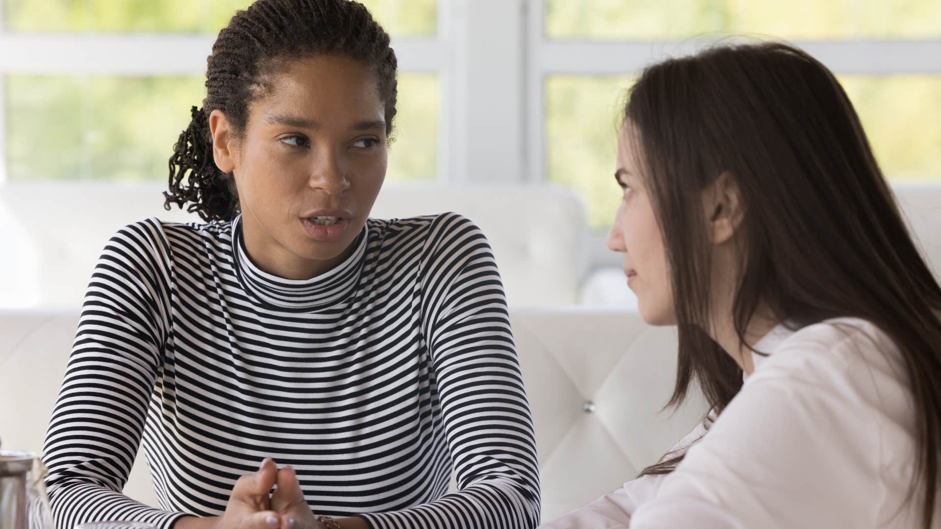 Two friends having a serious conversation.