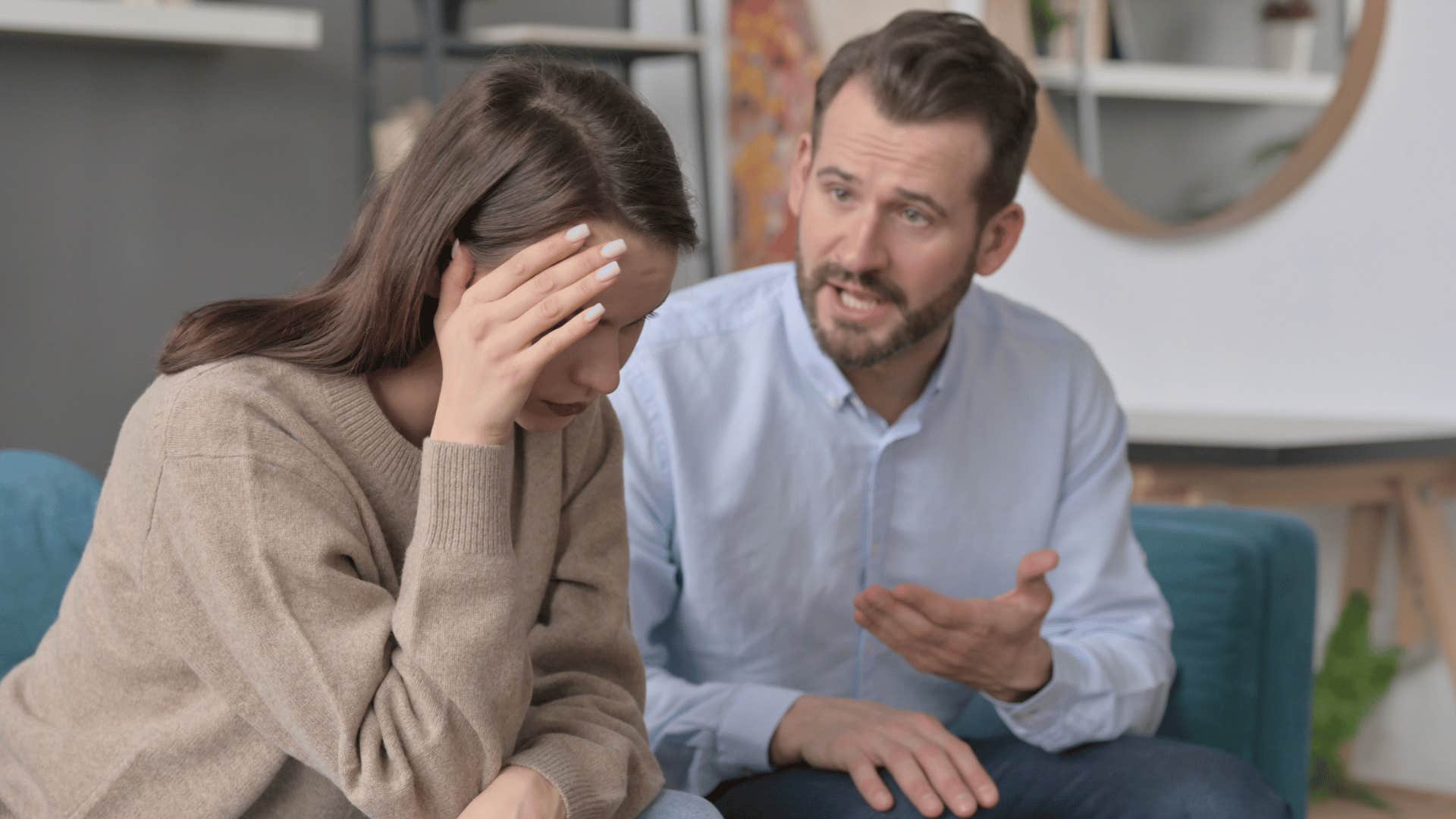 man talking with upset woman