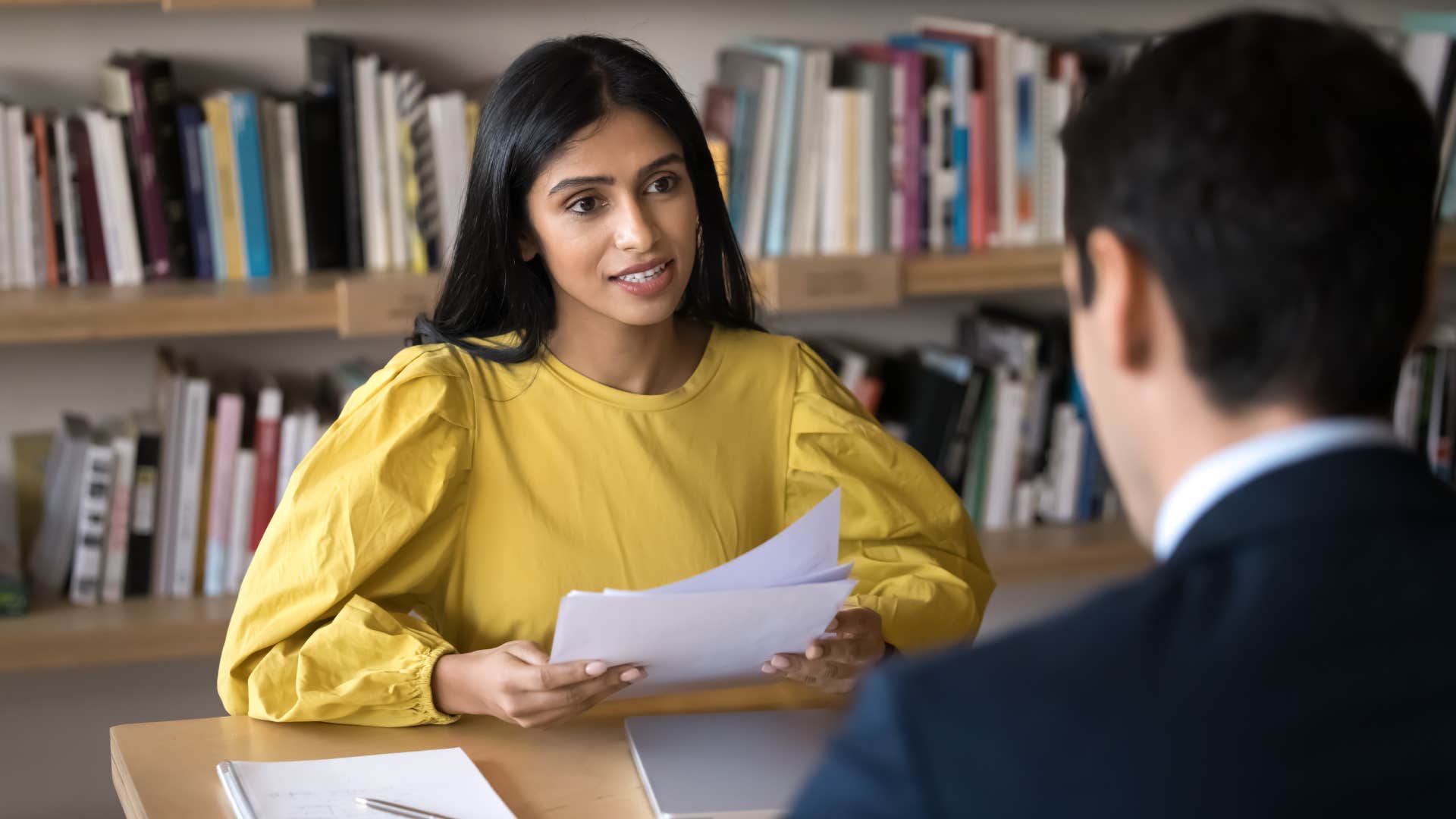 Young recruit manager woman talking to job candidate at interview