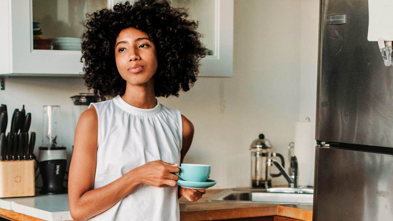 Worried woman, having coffee.