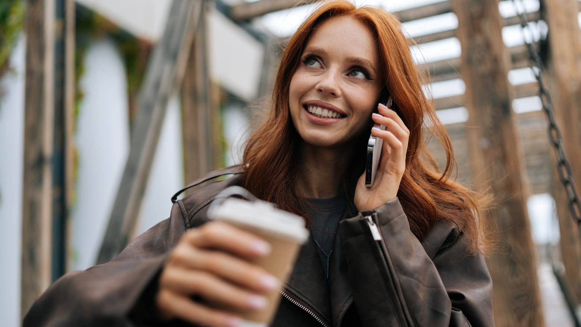 Woman smiling while talking on the phone. 