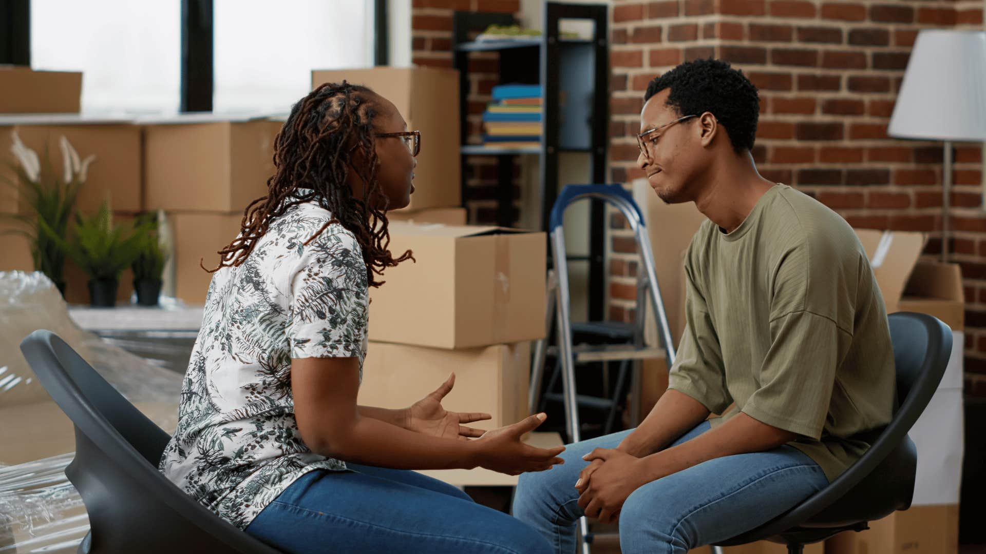 couple arguing among boxes