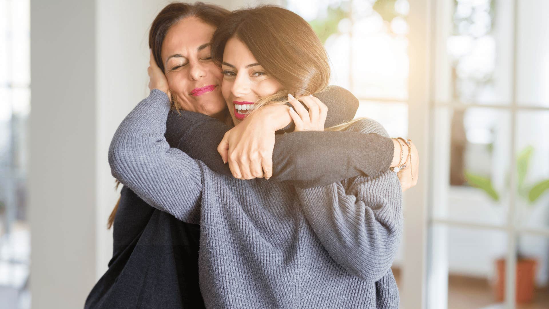 older woman and younger woman hugging