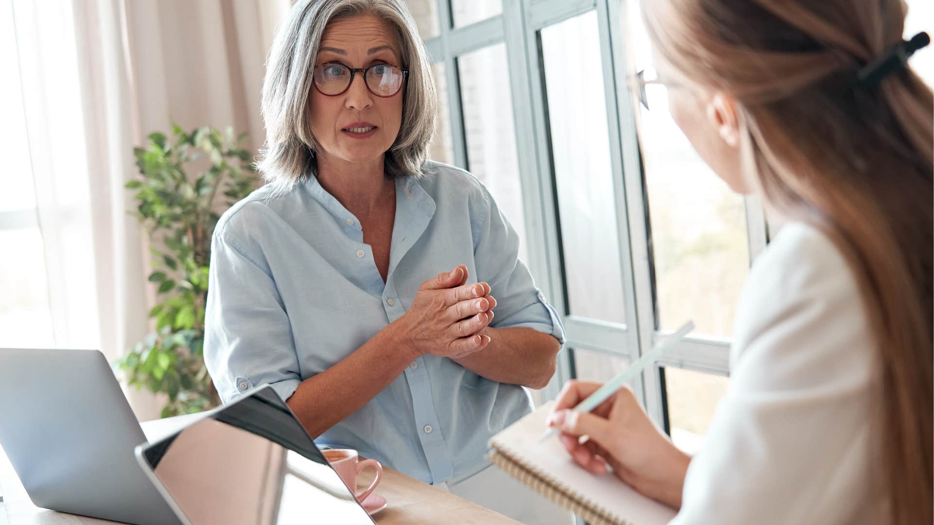 older woman explaining something to younger woman