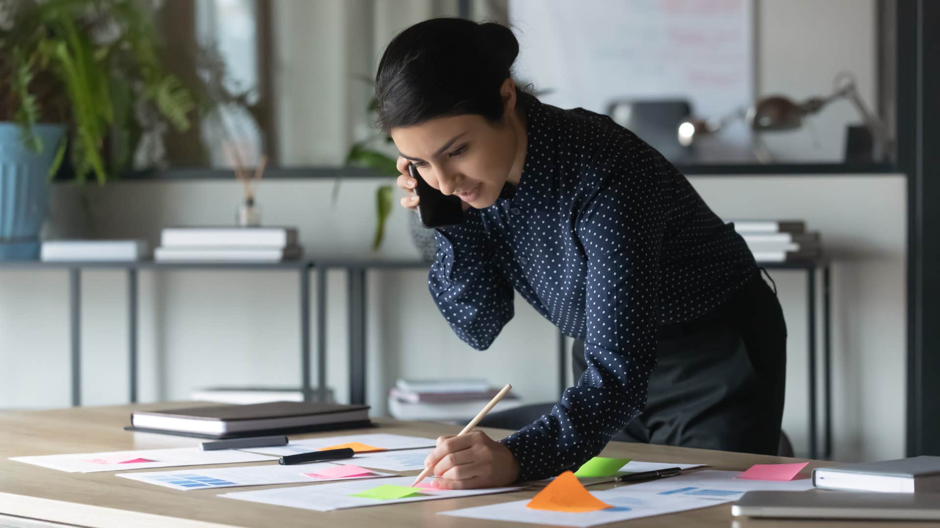 woman looking at her full schedule