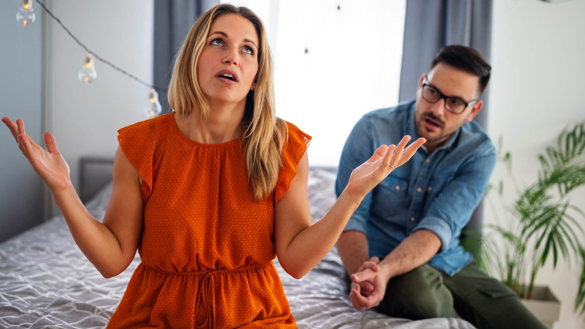 Woman looking annoyed while her partner talks to her