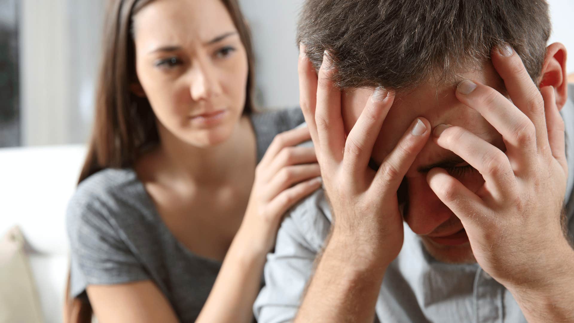 woman trying to comfort man