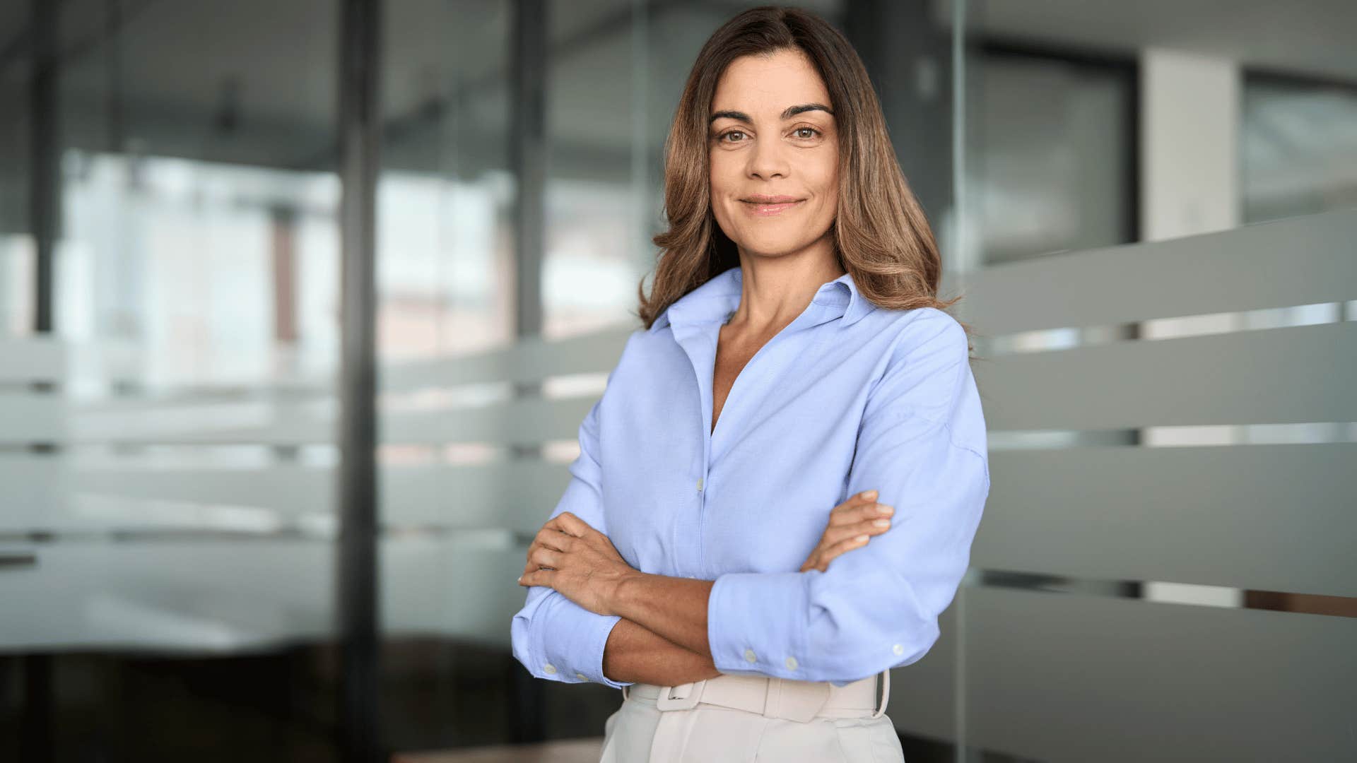 woman looking confident and crossing arms 