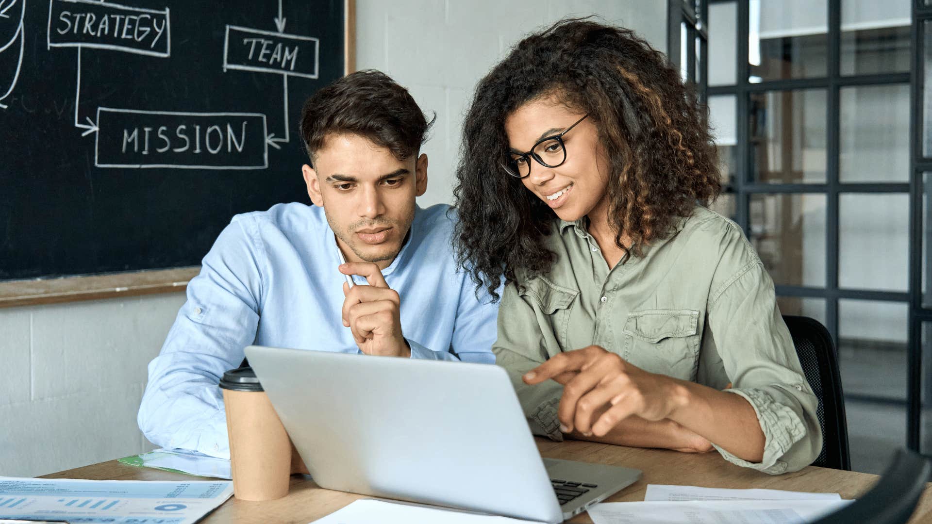 man and woman working together 