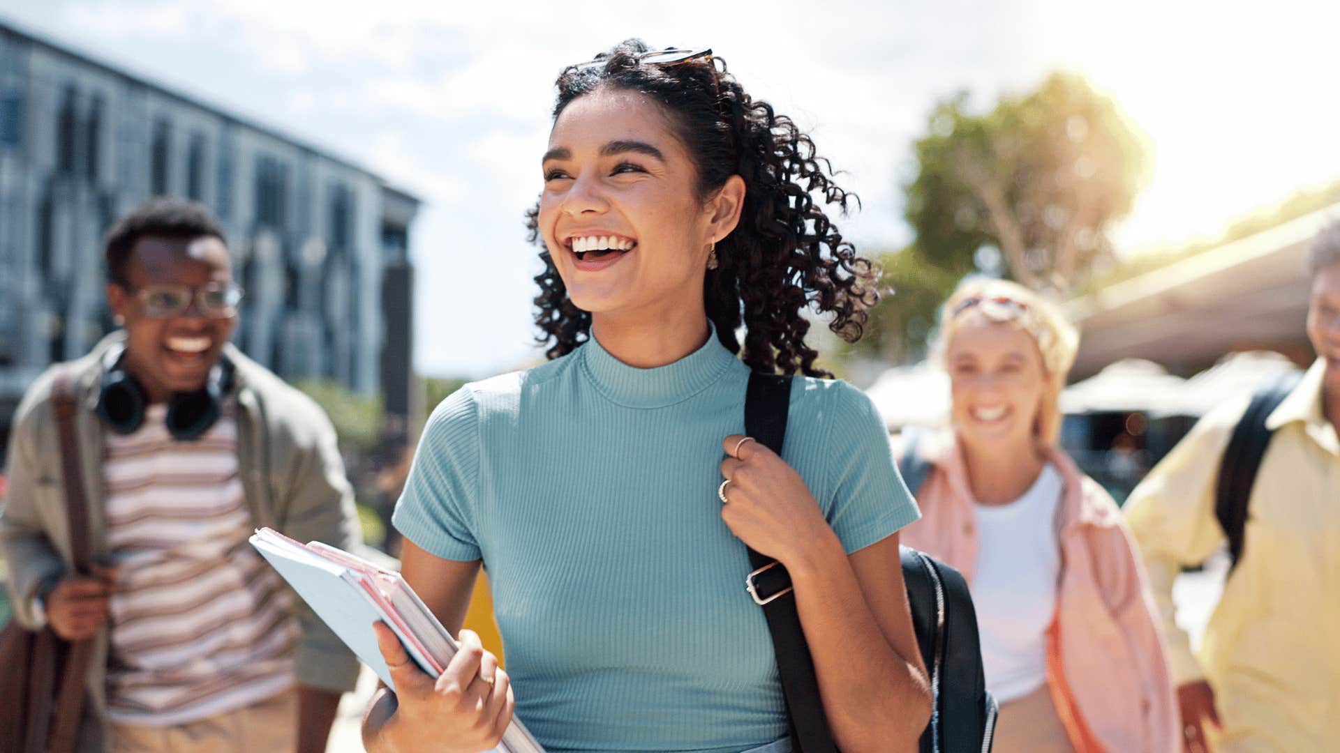 woman smiling while walking