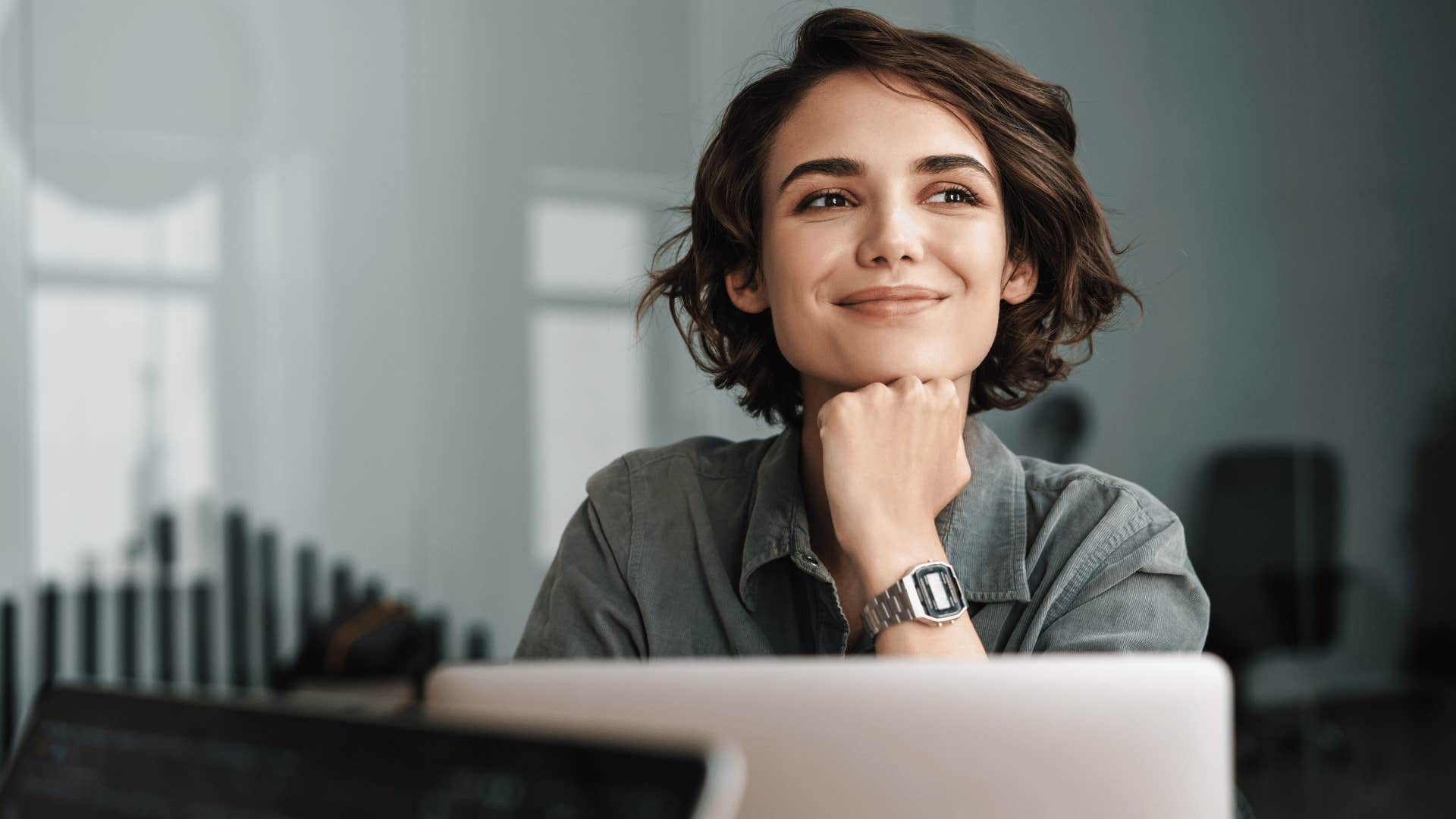 woman smiling and looking to the side