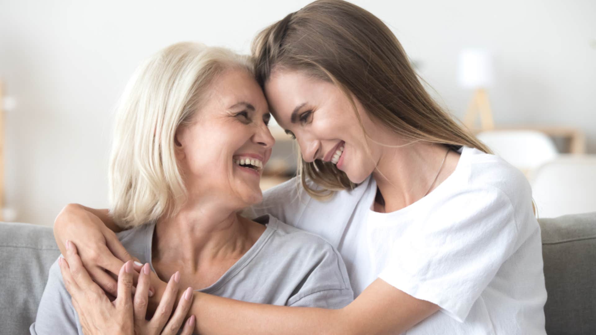 mom and daughter hugging 