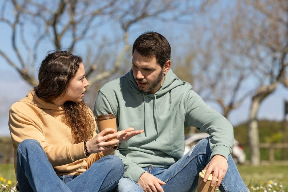 man and woman talking 