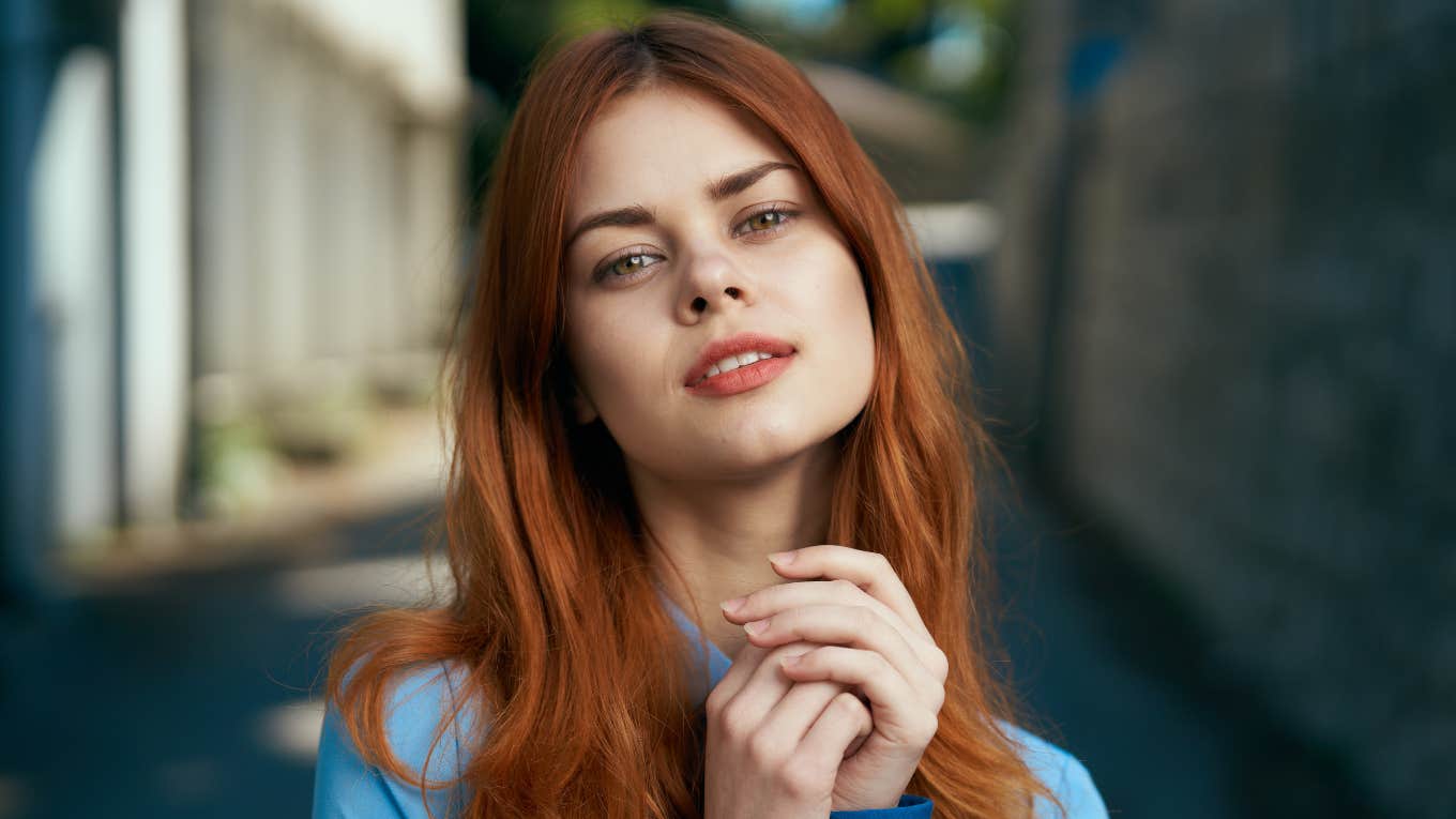 woman with red lips on the street portrait background