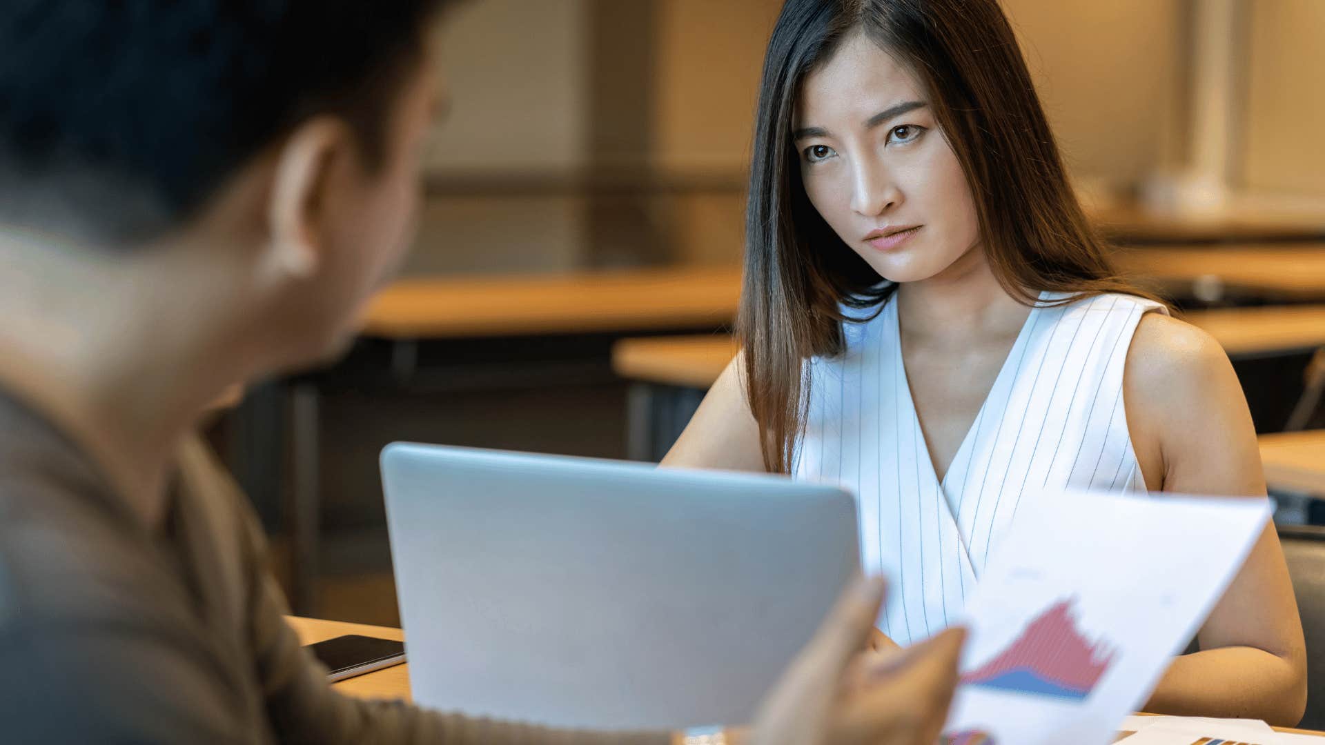 upset woman looking at man