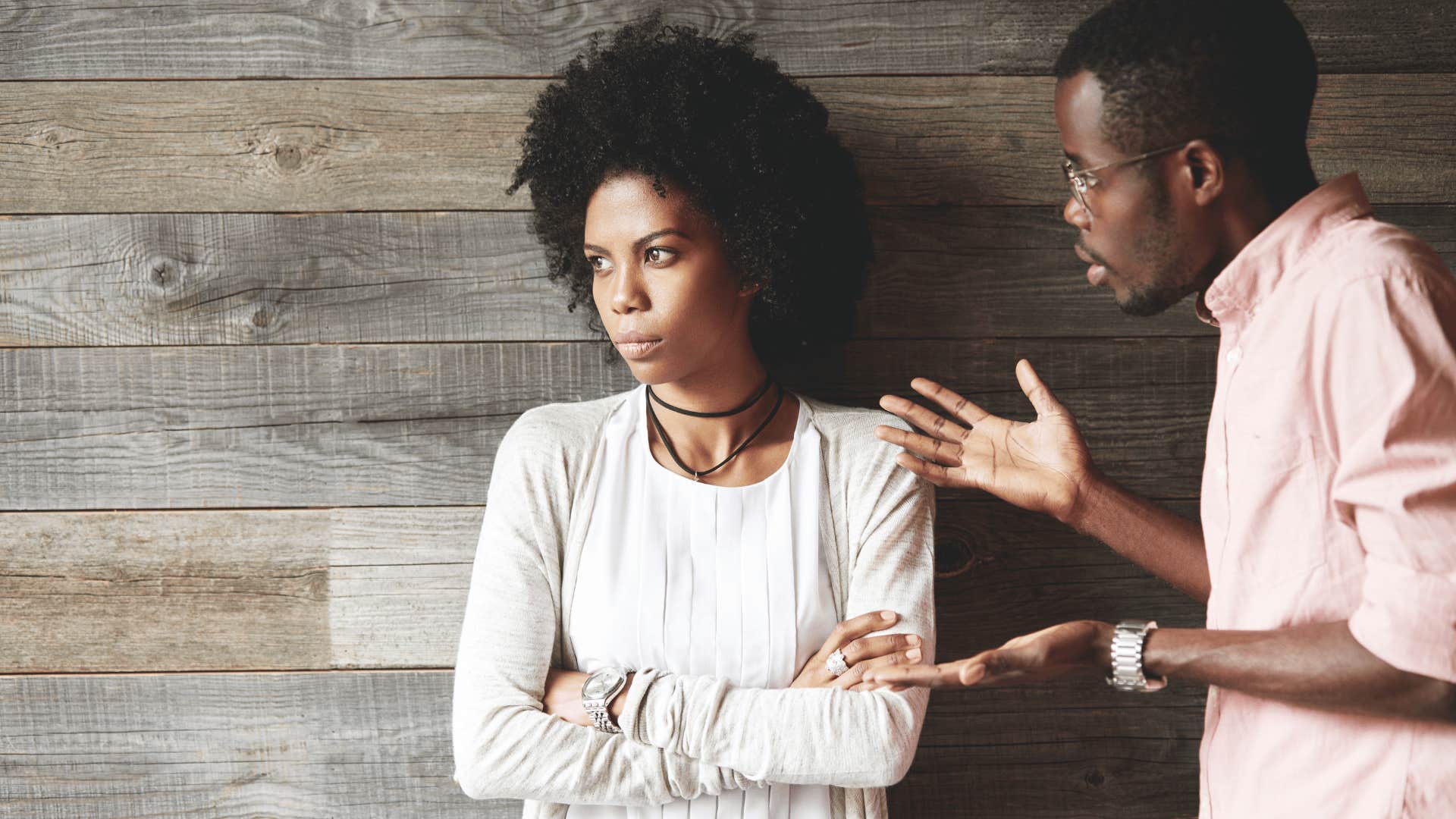 woman ignoring man talking to her