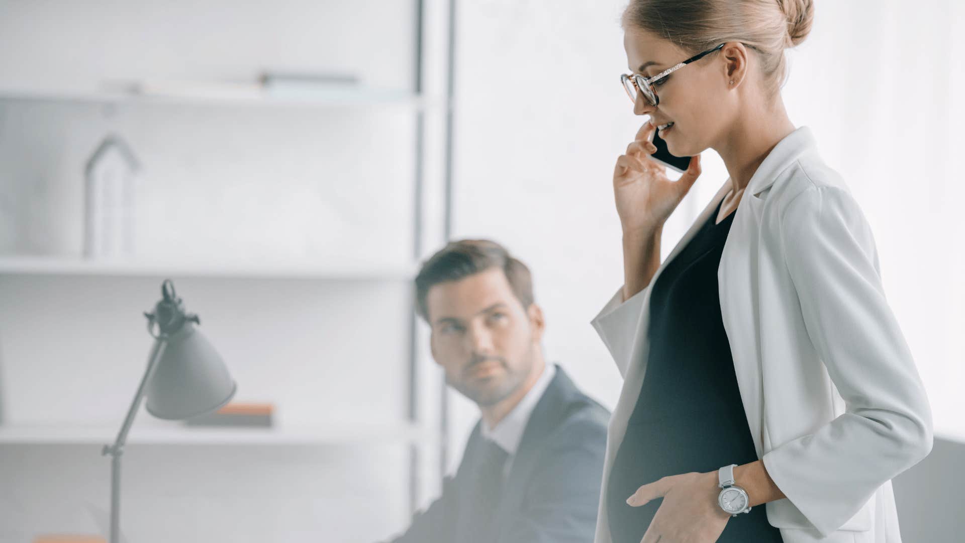 man looking at pregnant woman