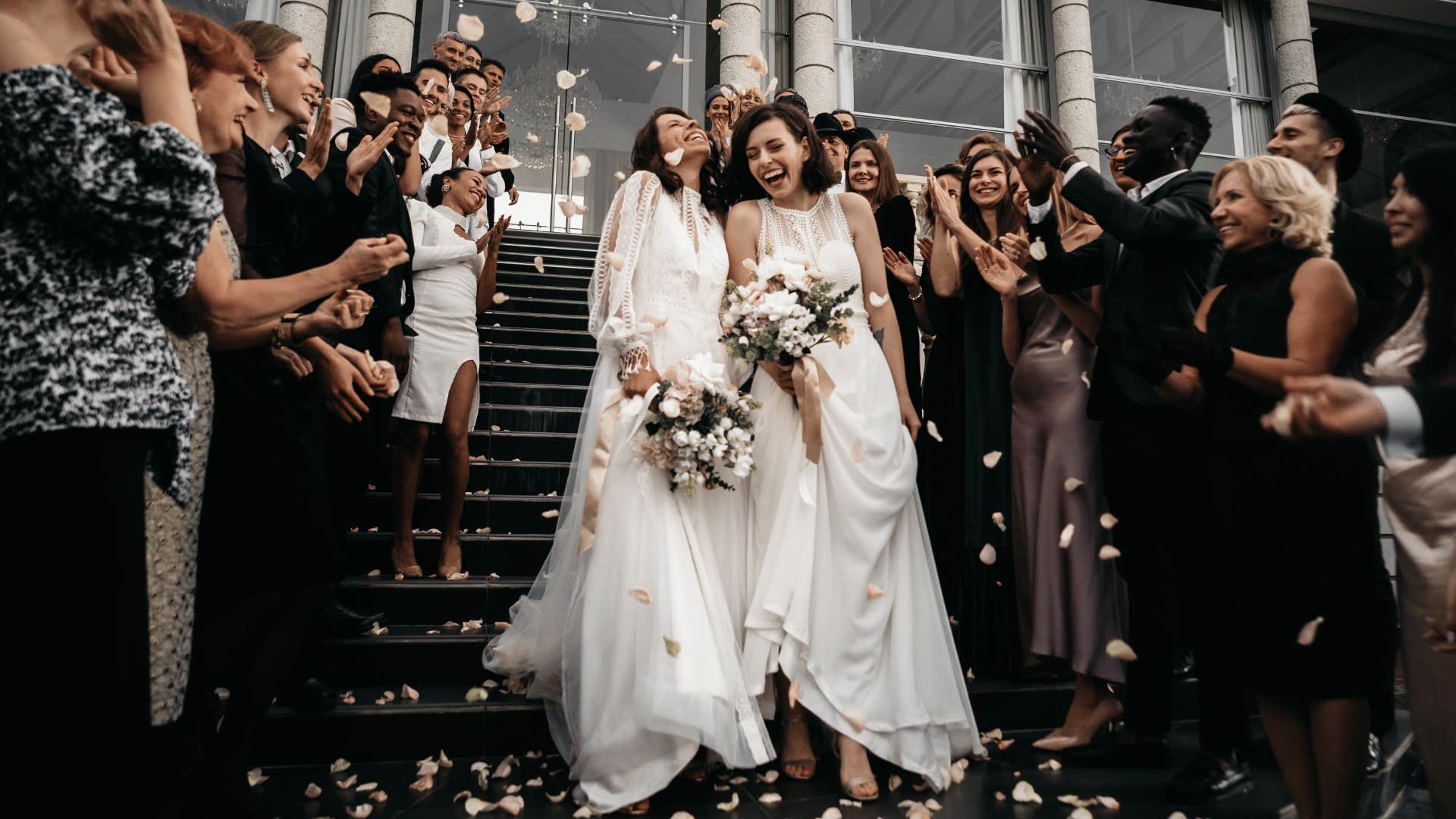 Brides walk through crowd without disrespect