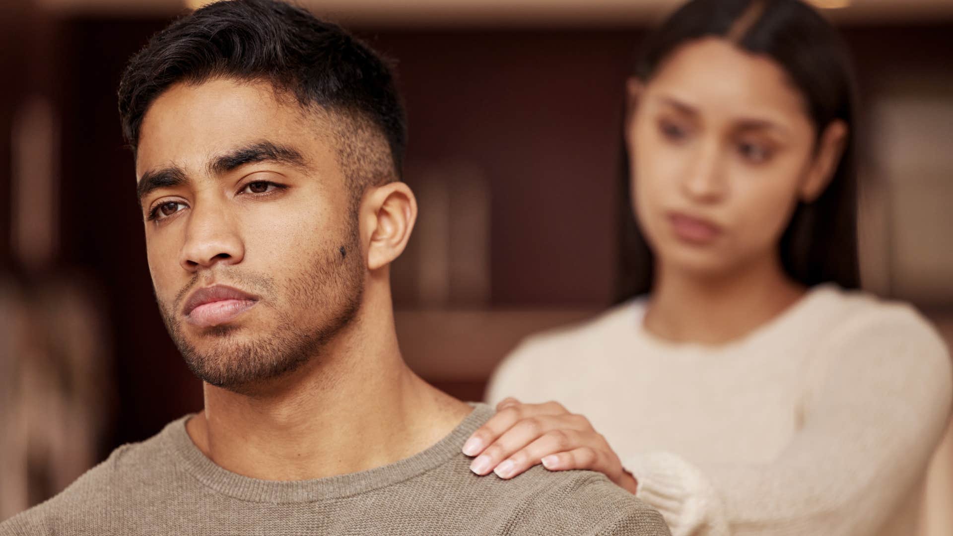 woman comforting her husband