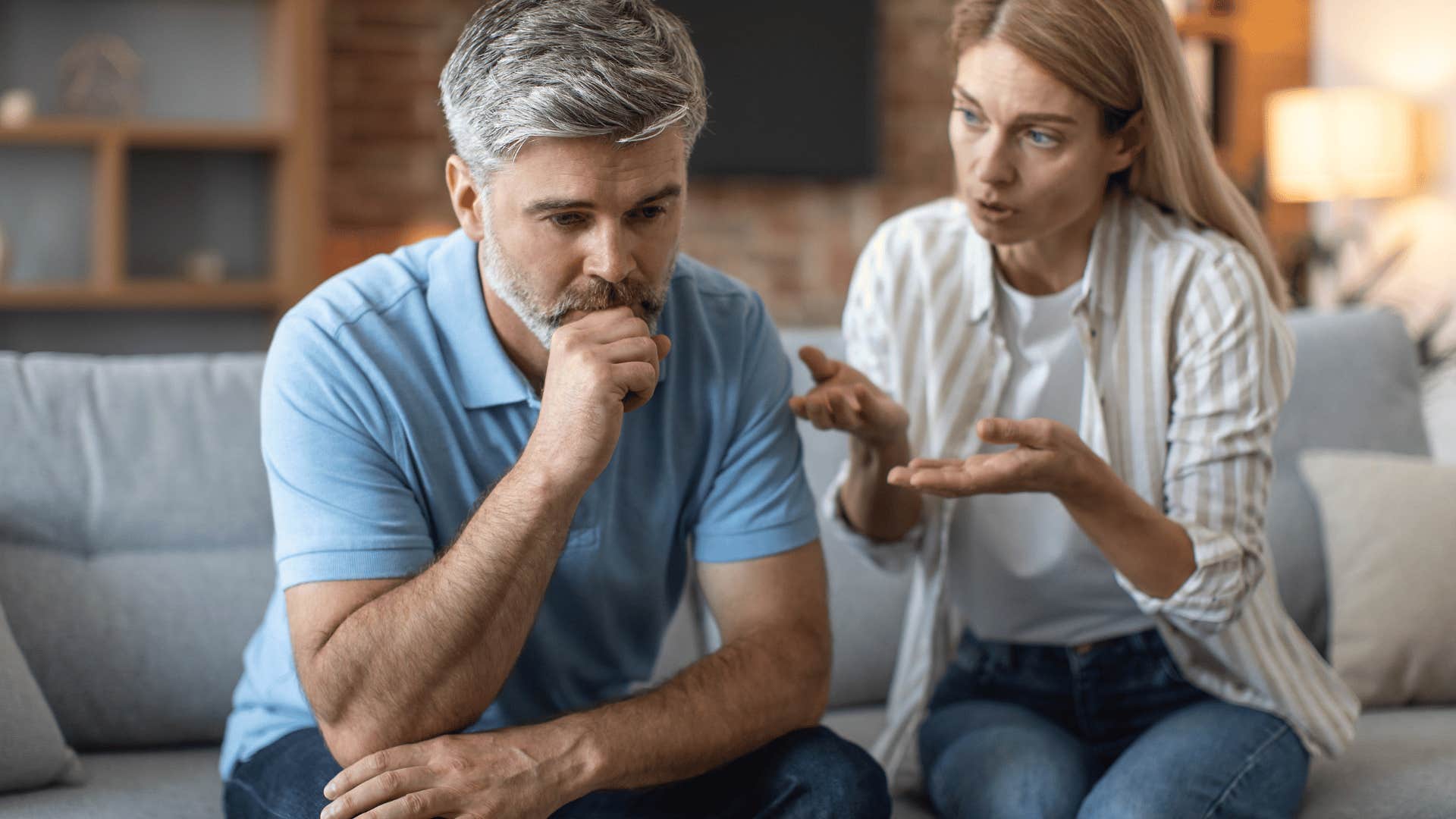 woman talking to man who's not responding