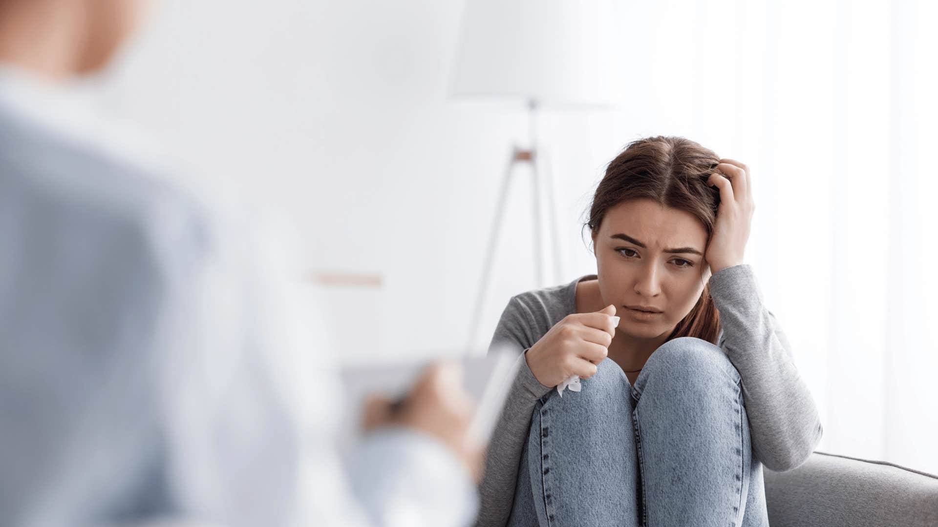 upset woman with tissue