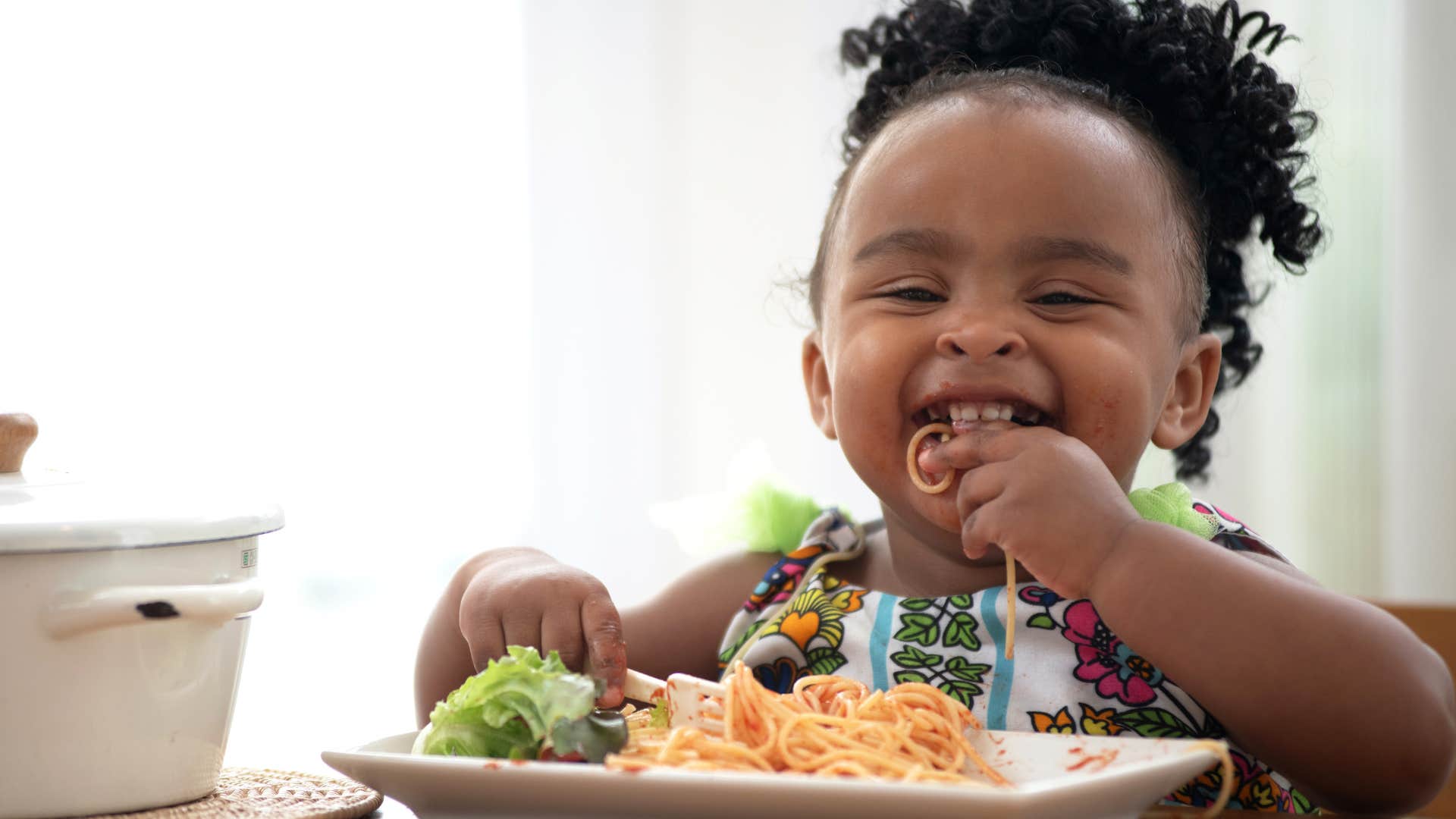 happy only child eating slowly