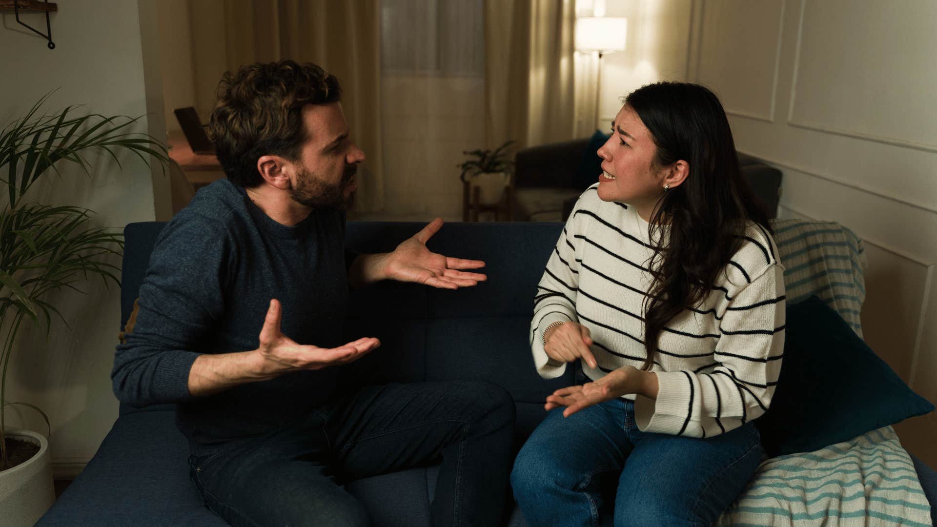 couple arguing on couch