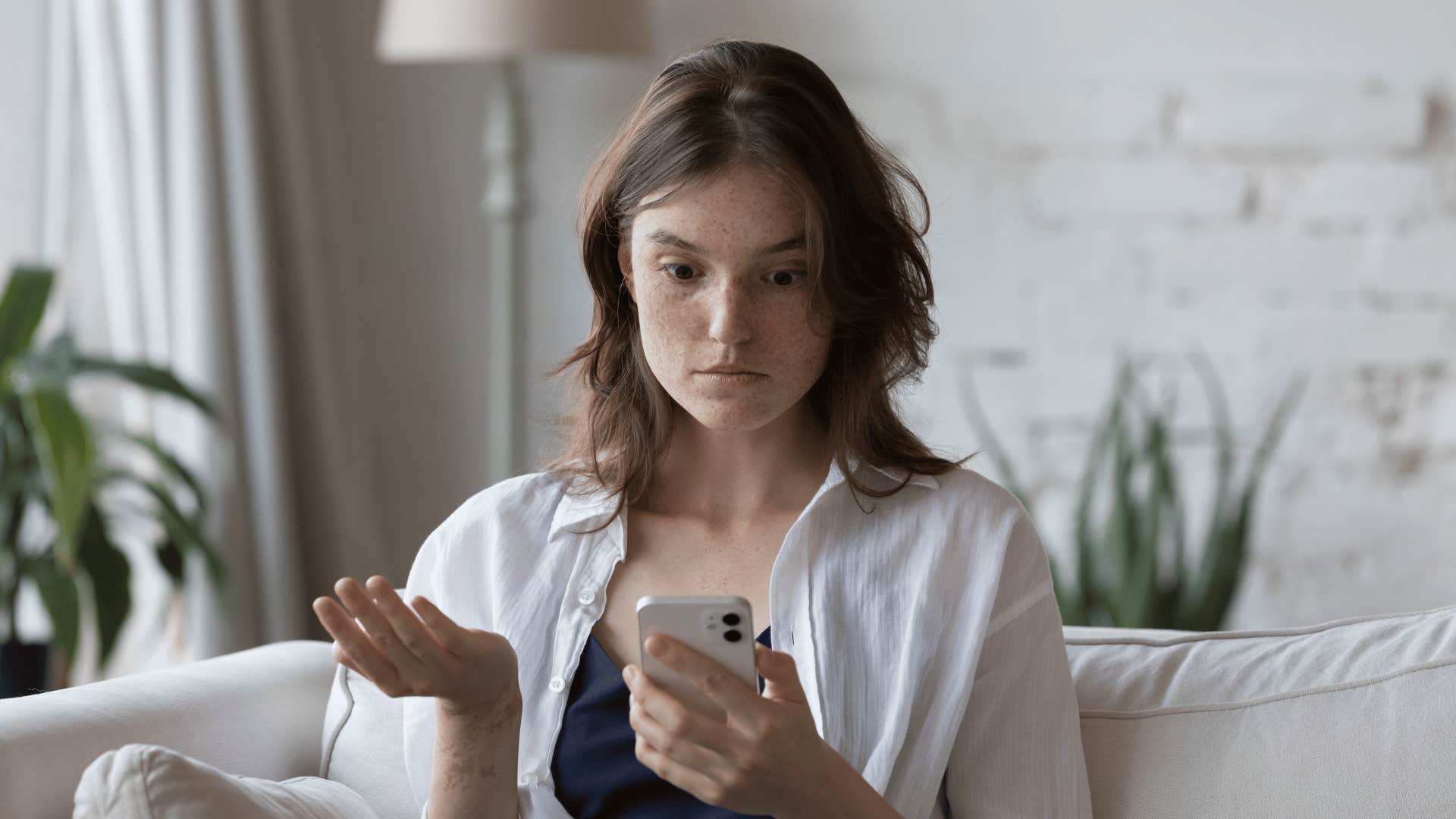 woman looking at phone