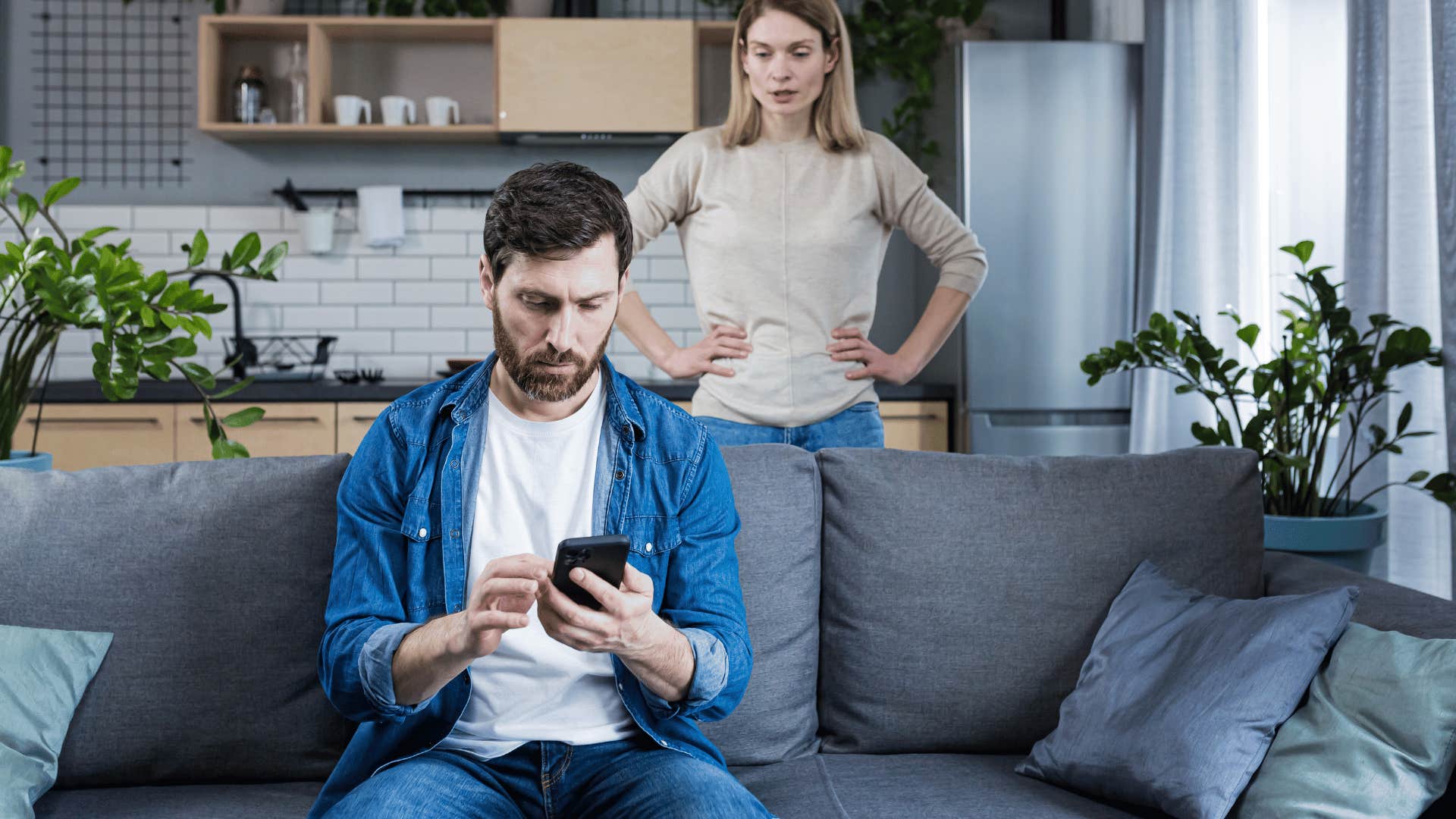 man on his phone ignoring woman