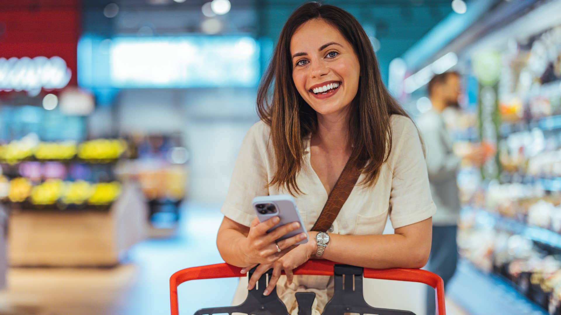 Woman smiling in the grocery store.