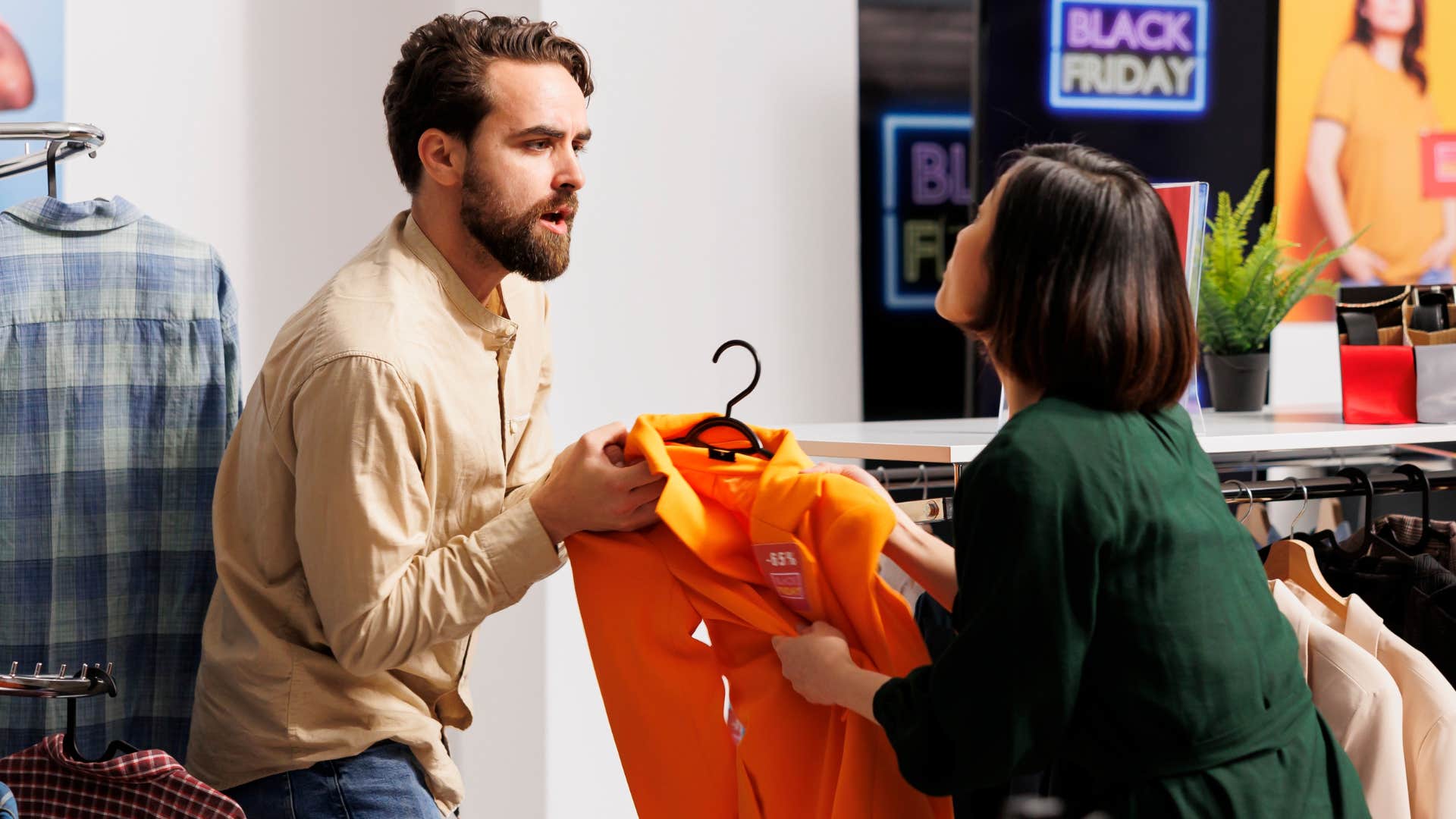 Man arguing with a service worker in a store.