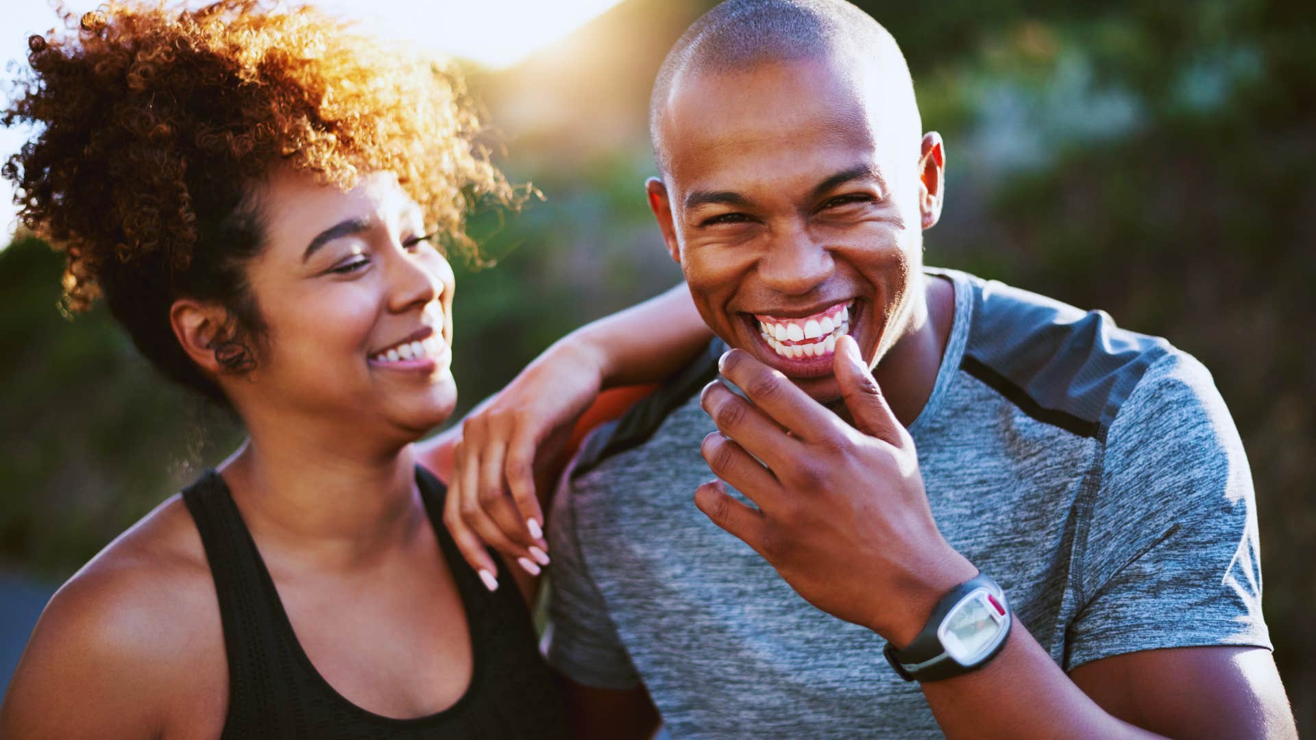 man and woman exercising together