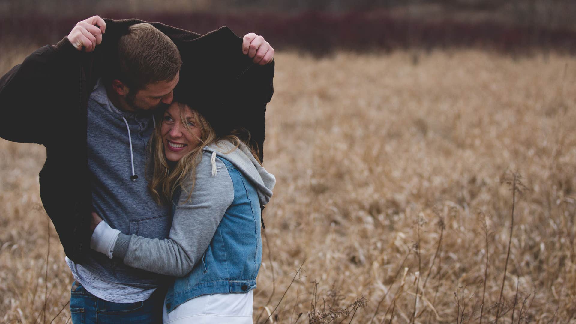 man and woman supporting each other