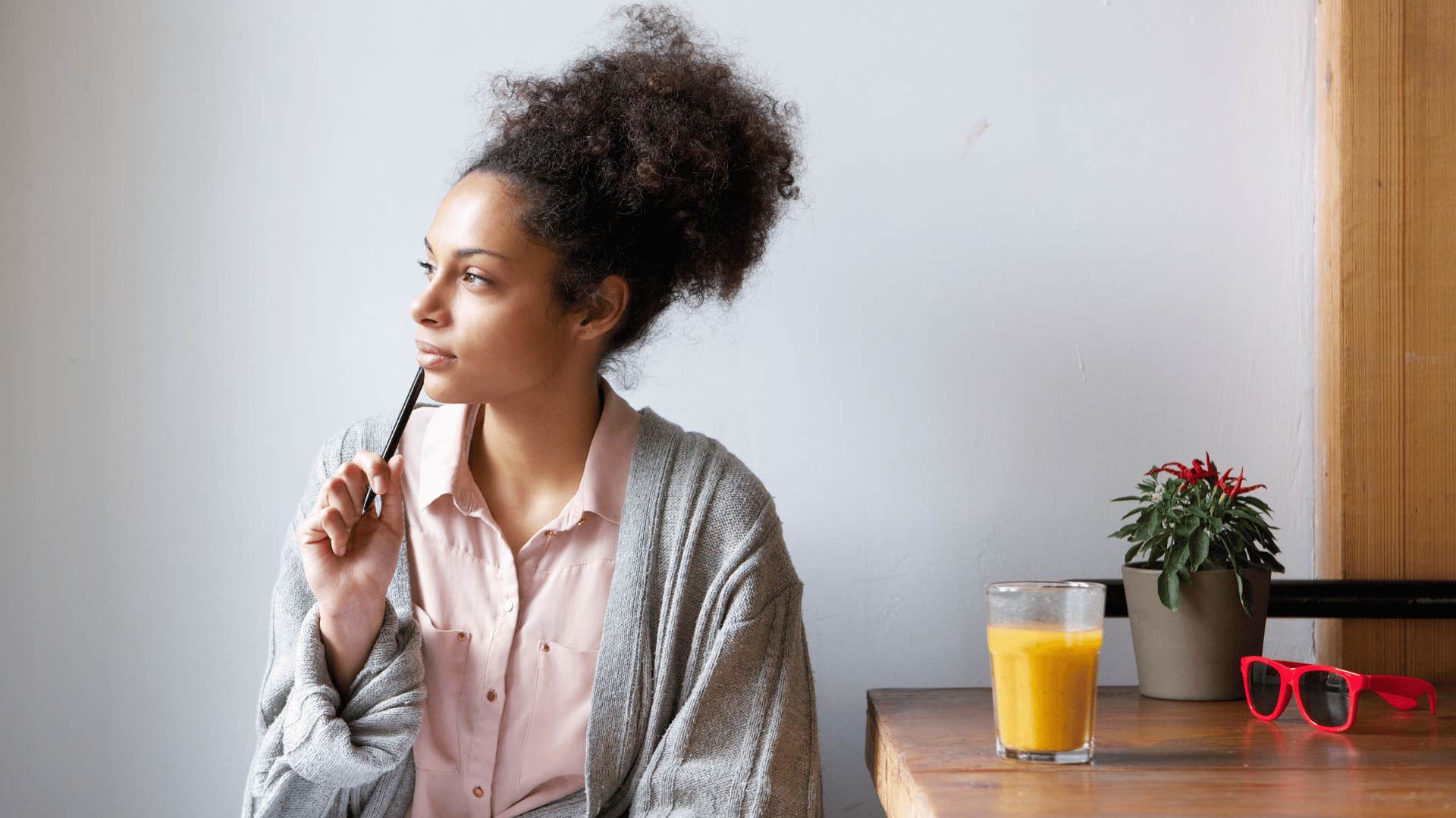 woman thinking while looking around