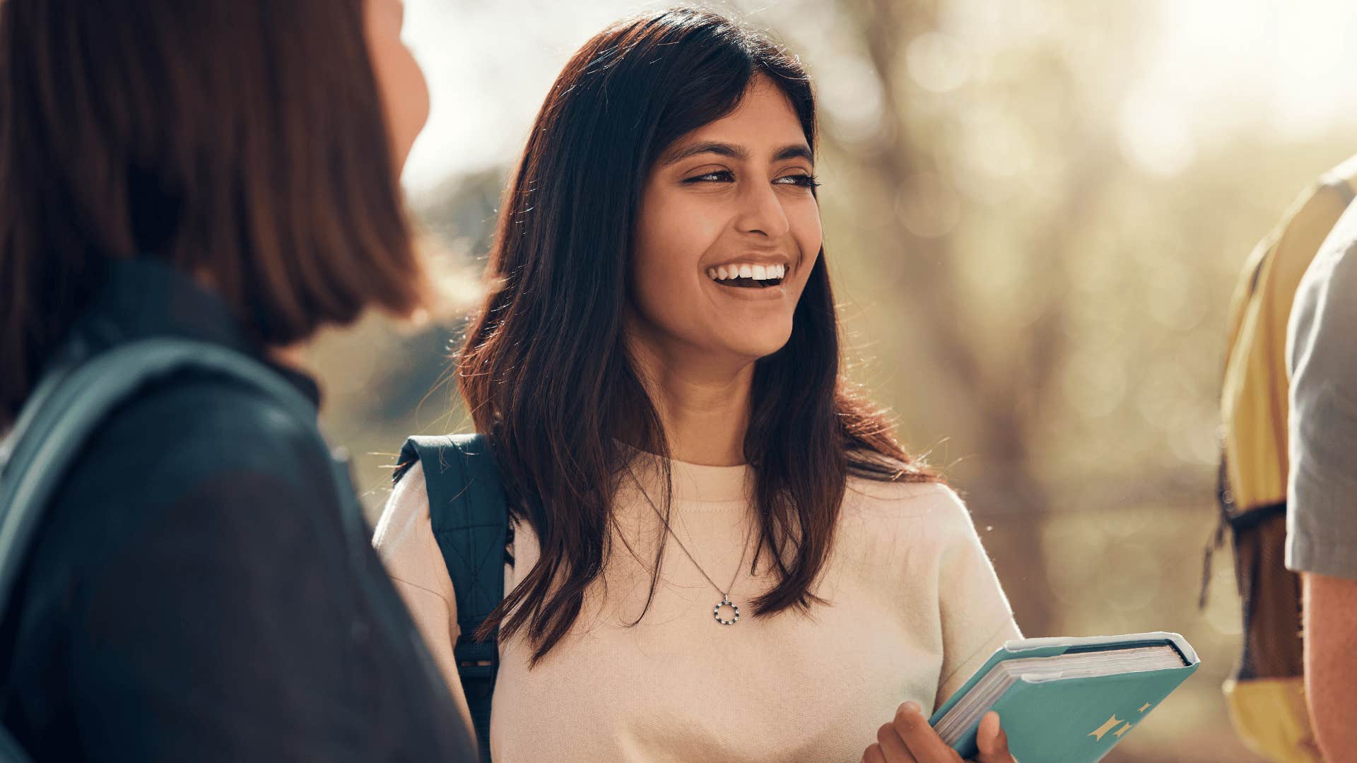 smiling woman talking to friends