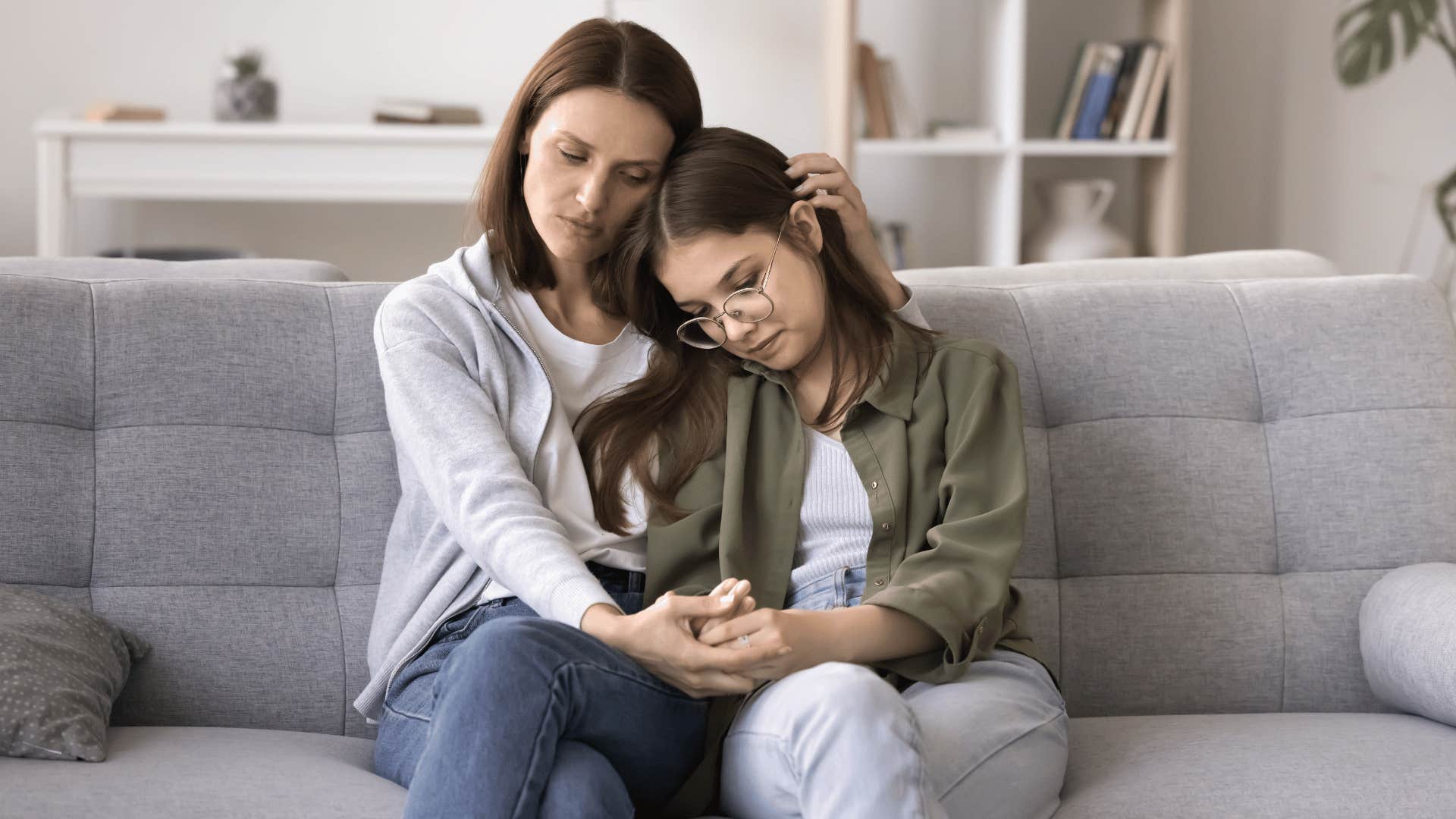 mom comforting her daughter