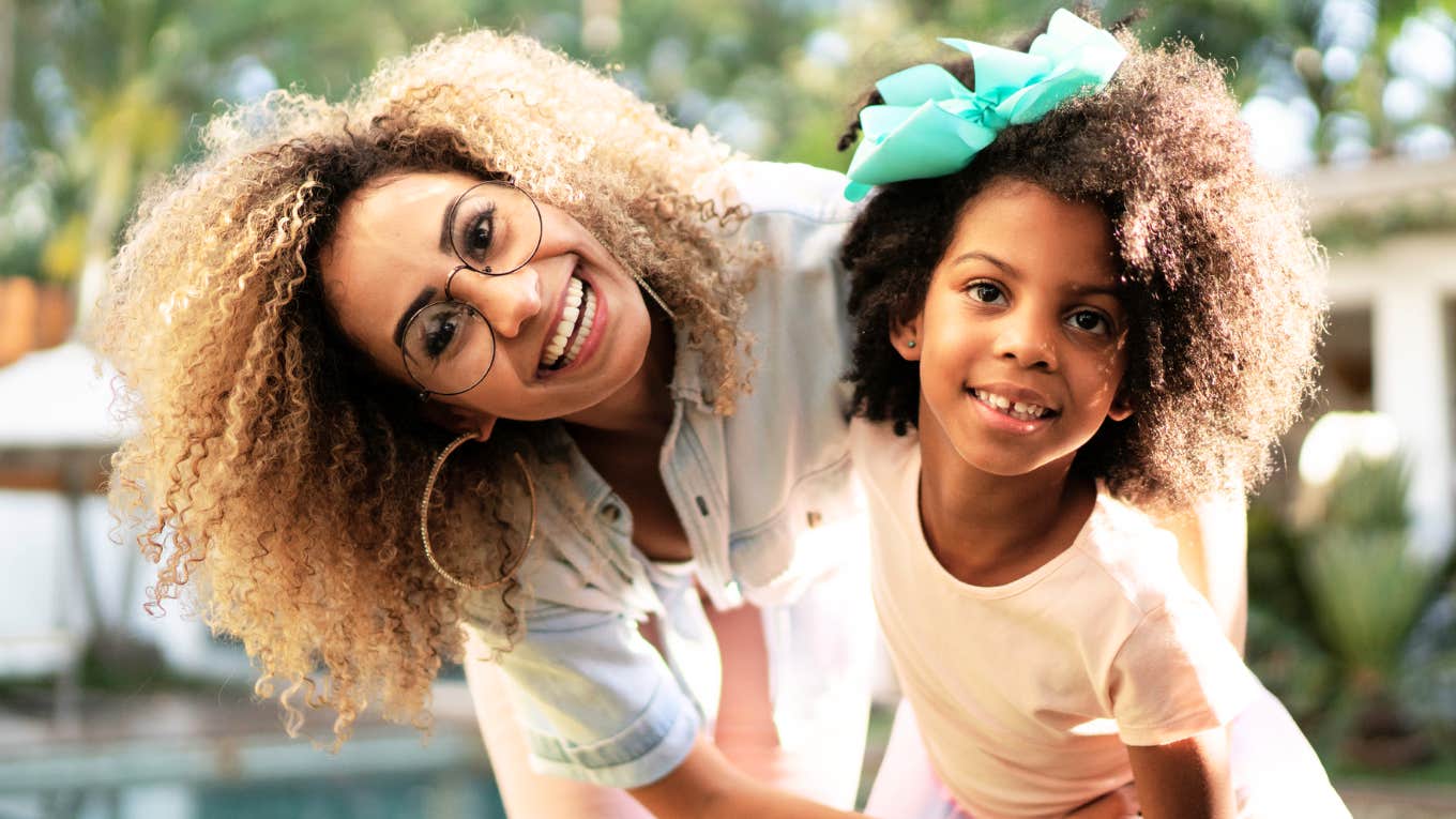 Single mother with her happy daughter. 