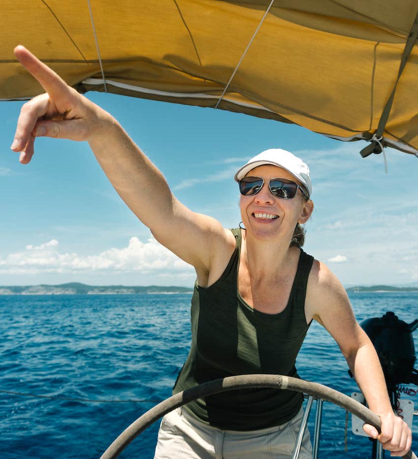 Woman at the helm of a boat