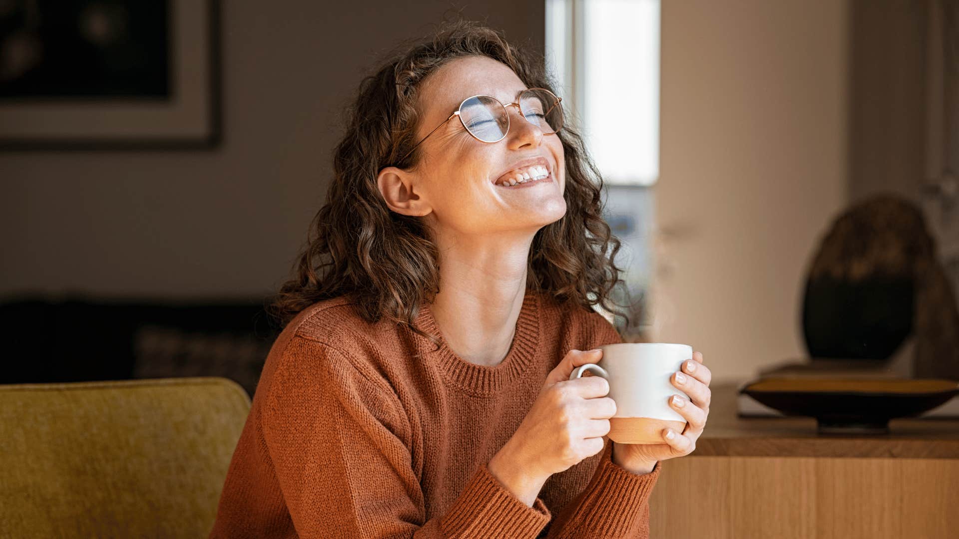 woman smiling with coffee