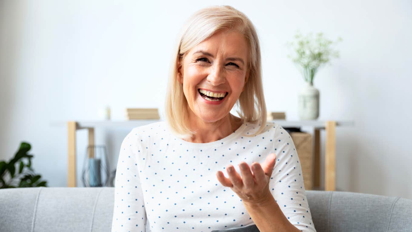 Woman speaking with her hands, engaged in conversation.