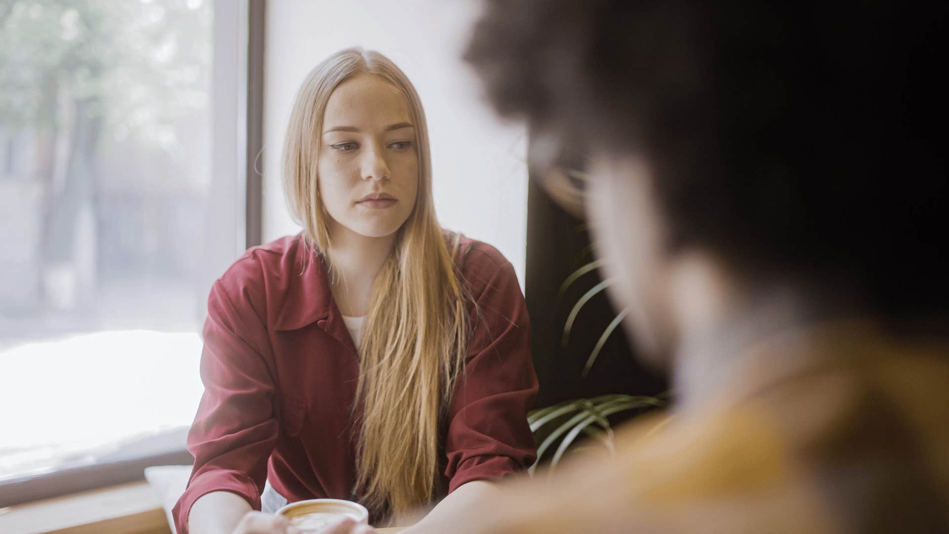 woman having a fight with boyfriend on date