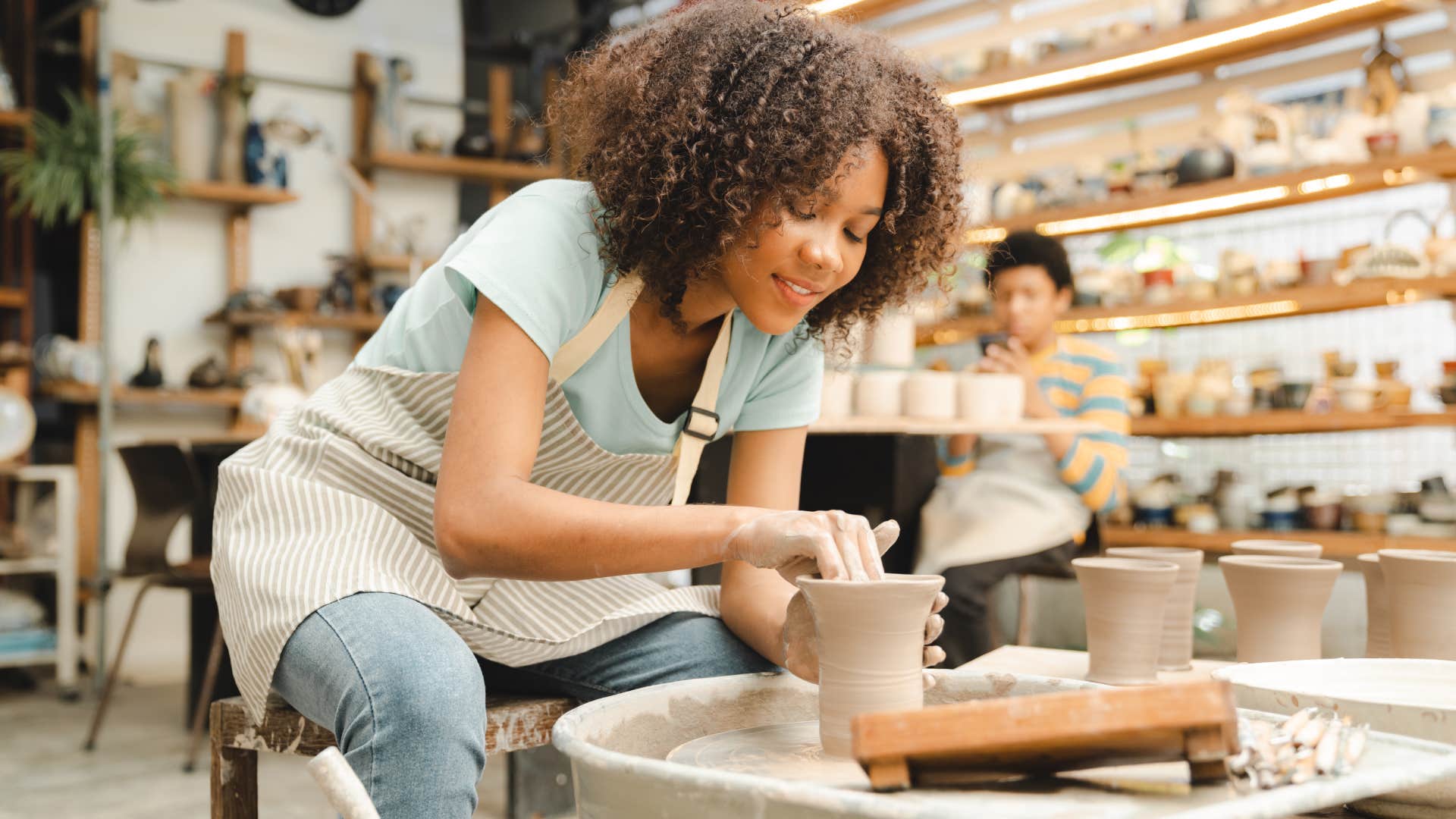 young woman doing pottery