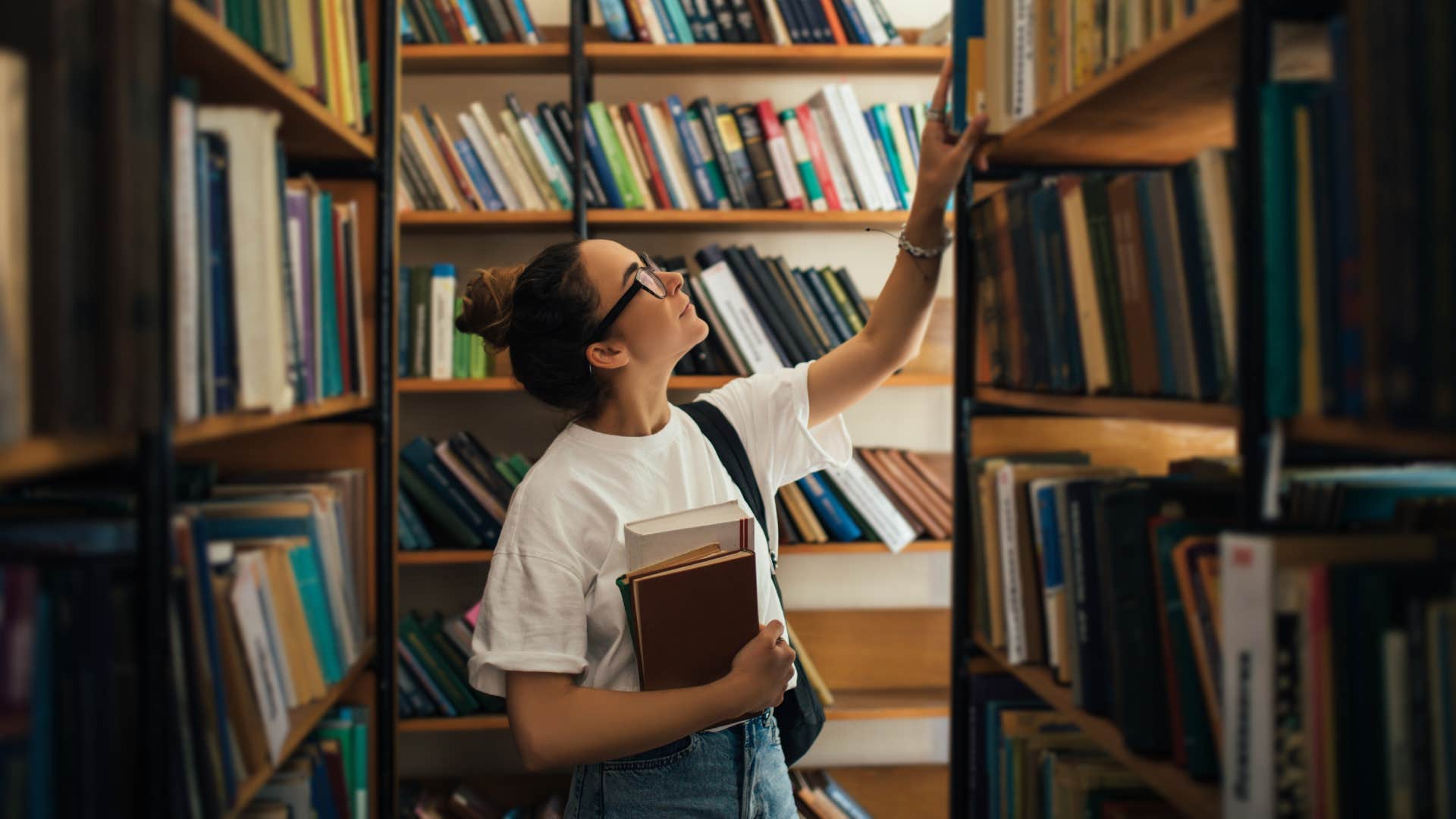 woman picking out books 