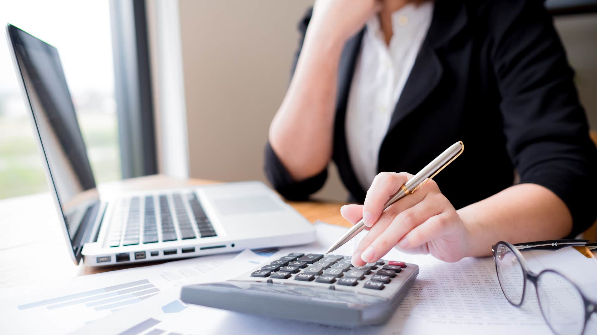 Woman calculating number for negotiating