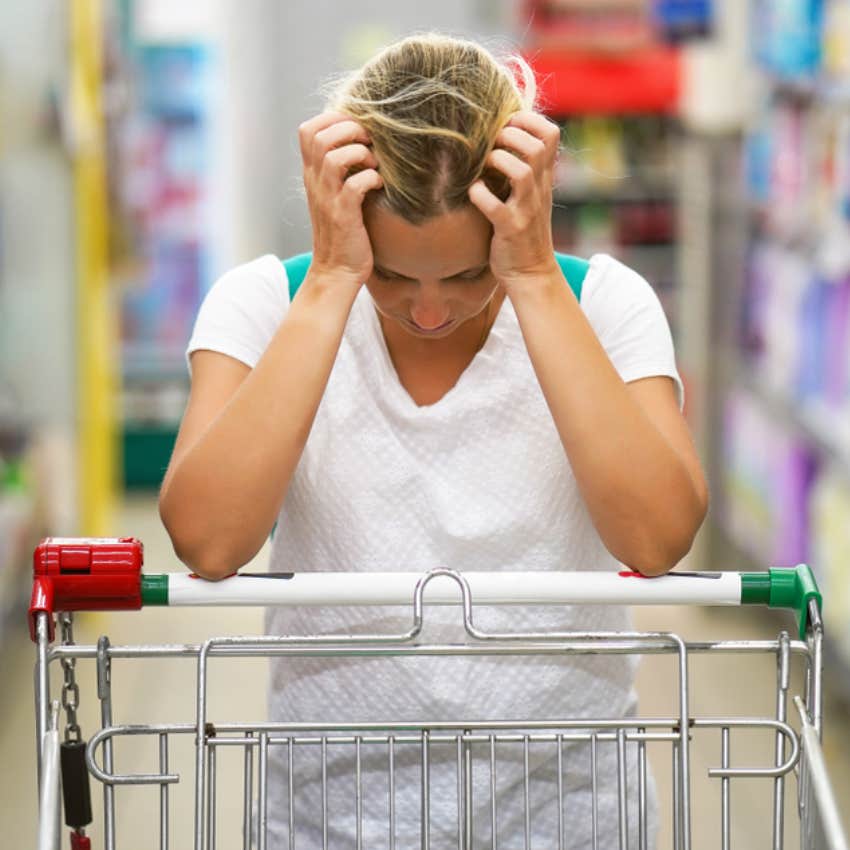 stressed woman grocery shopping