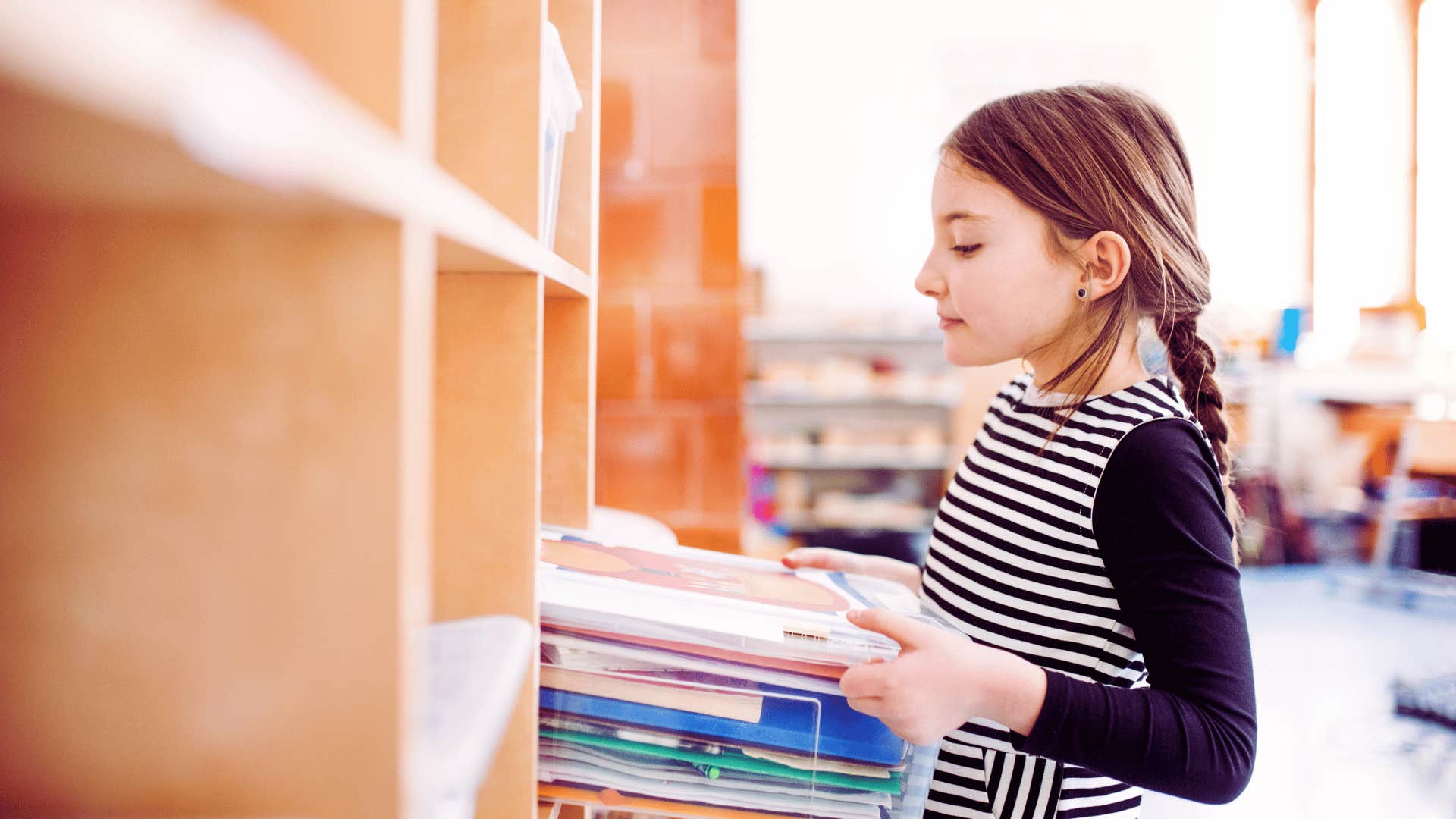 girl keeping track of her books