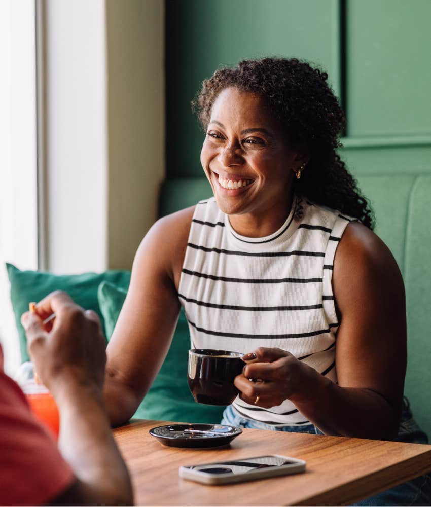 Woman smiling because she's strong, independent and it's not about being attractive