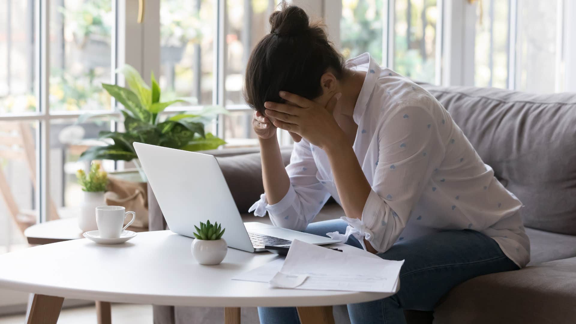 frustrated woman trying to pay her taxes online