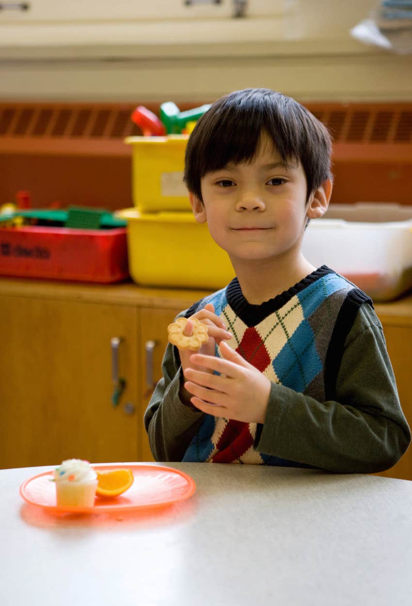 Elementary school student enjoying snacks