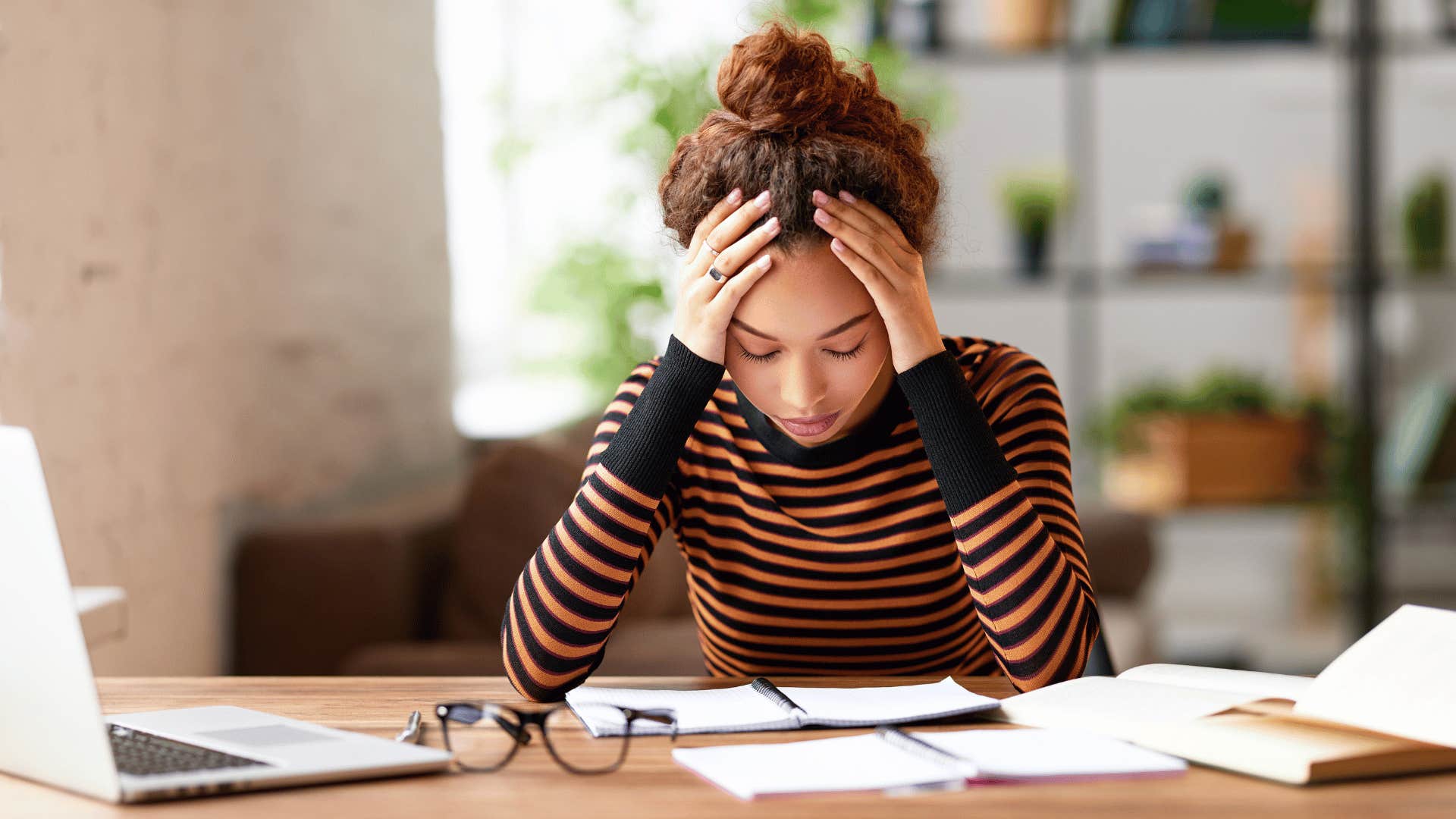 woman looking frustrated with work